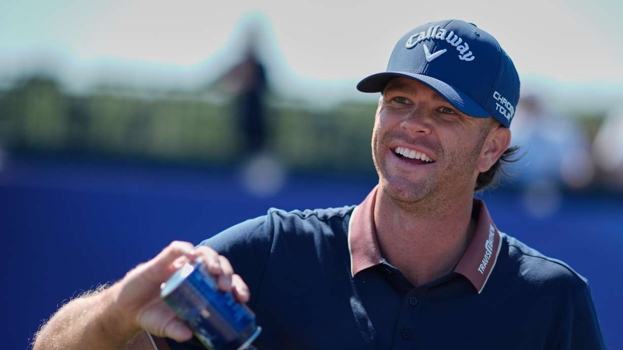 Marcus Plunkett of the United States fills his water bottle on the 15th hole during a practice round for the British Open Golf championships at Royal Birkdale golf club, in Southport, England, Tuesday, July 14, 2026.