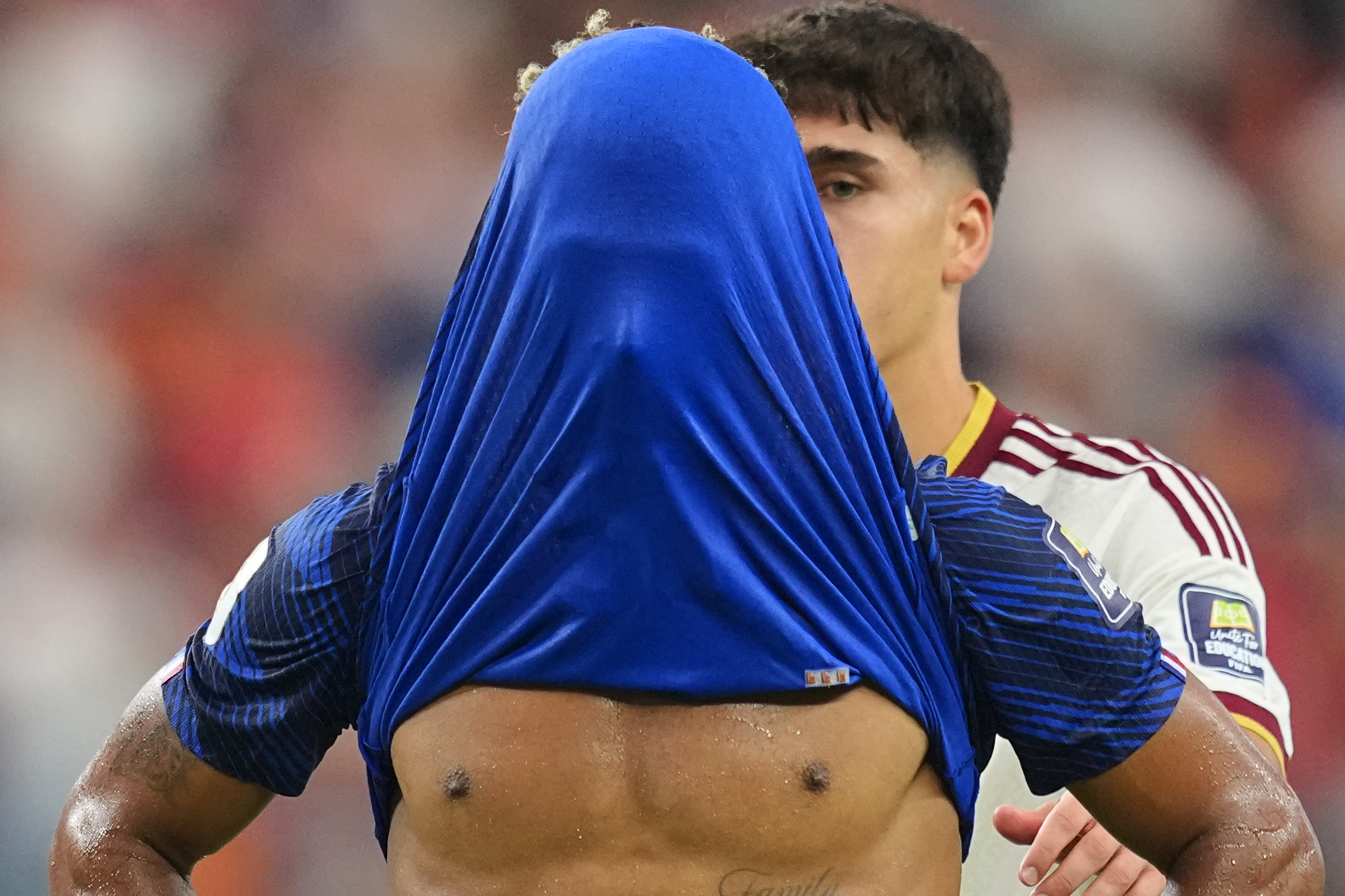 France's Desire Doue covers his face after his side's lost against in a World Cup semifinal soccer match in Arlington, Texas, near Dallas, Tuesday, July 14, 2026. 