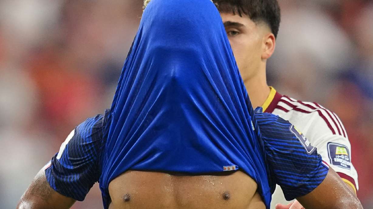 France's Desire Doue covers his face after his side's lost against in a World Cup semifinal soccer match in Arlington, Texas, near Dallas, Tuesday, July 14, 2026.