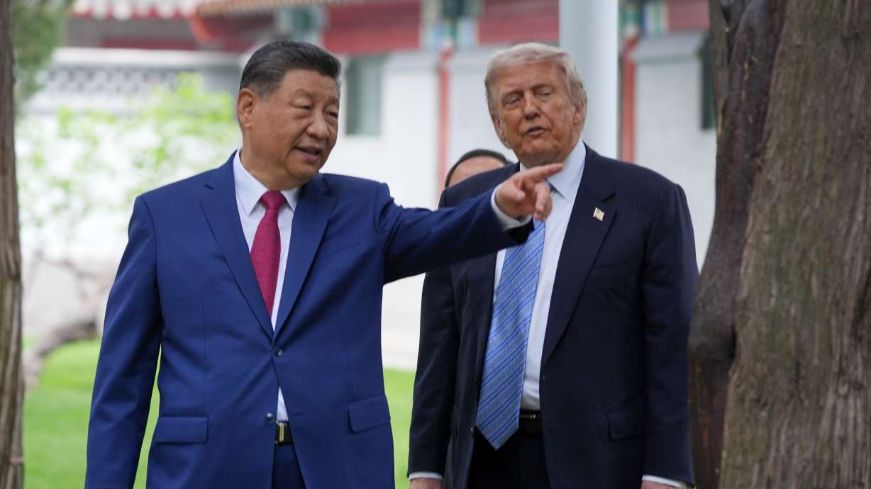 President Donald Trump talks with China's President Xi Jinping at the Zhongnanhai leadership compound, May 15, in Beijing. China on Friday rejected Trump's election interference claims as "groundless accusations."