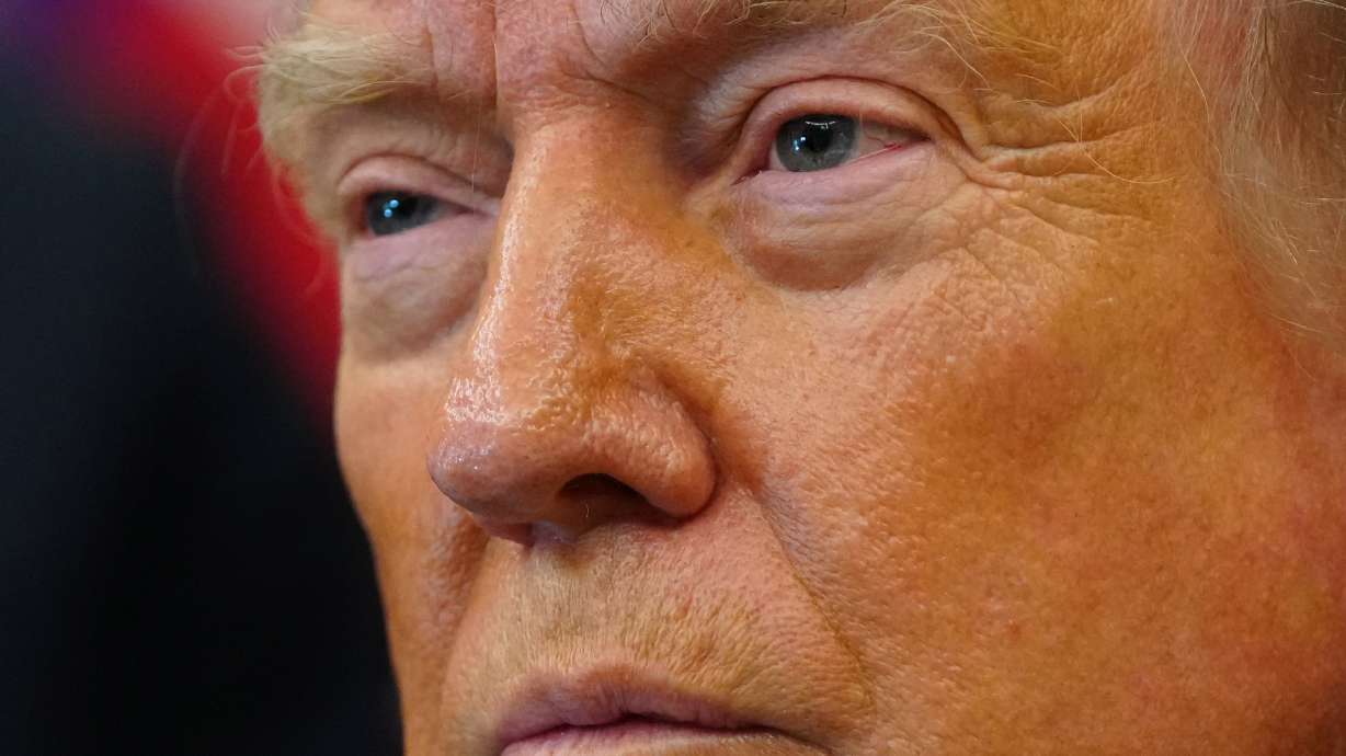 President Donald Trump listens after signing executive orders modifying the Bears Ears National Monument and the Grand Staircase-Escalante National Monument in the Oval Office of the White House, Monday, in Washington.