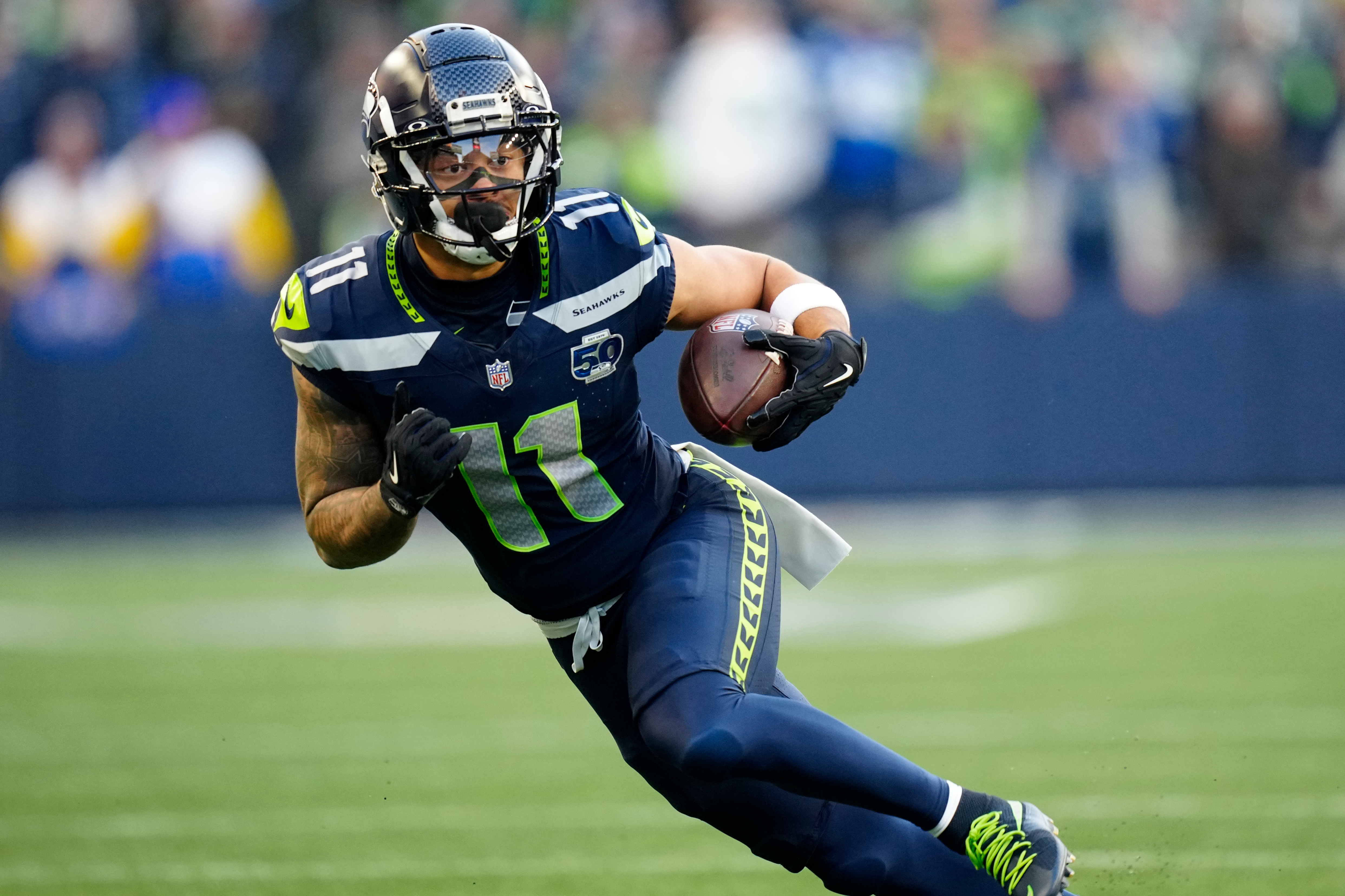 FILE - Seattle Seahawks wide receiver Jaxon Smith-Njigba (11) runs with the ball during the NFC Championship NFL football game Jan. 25, 2026, in Seattle. 