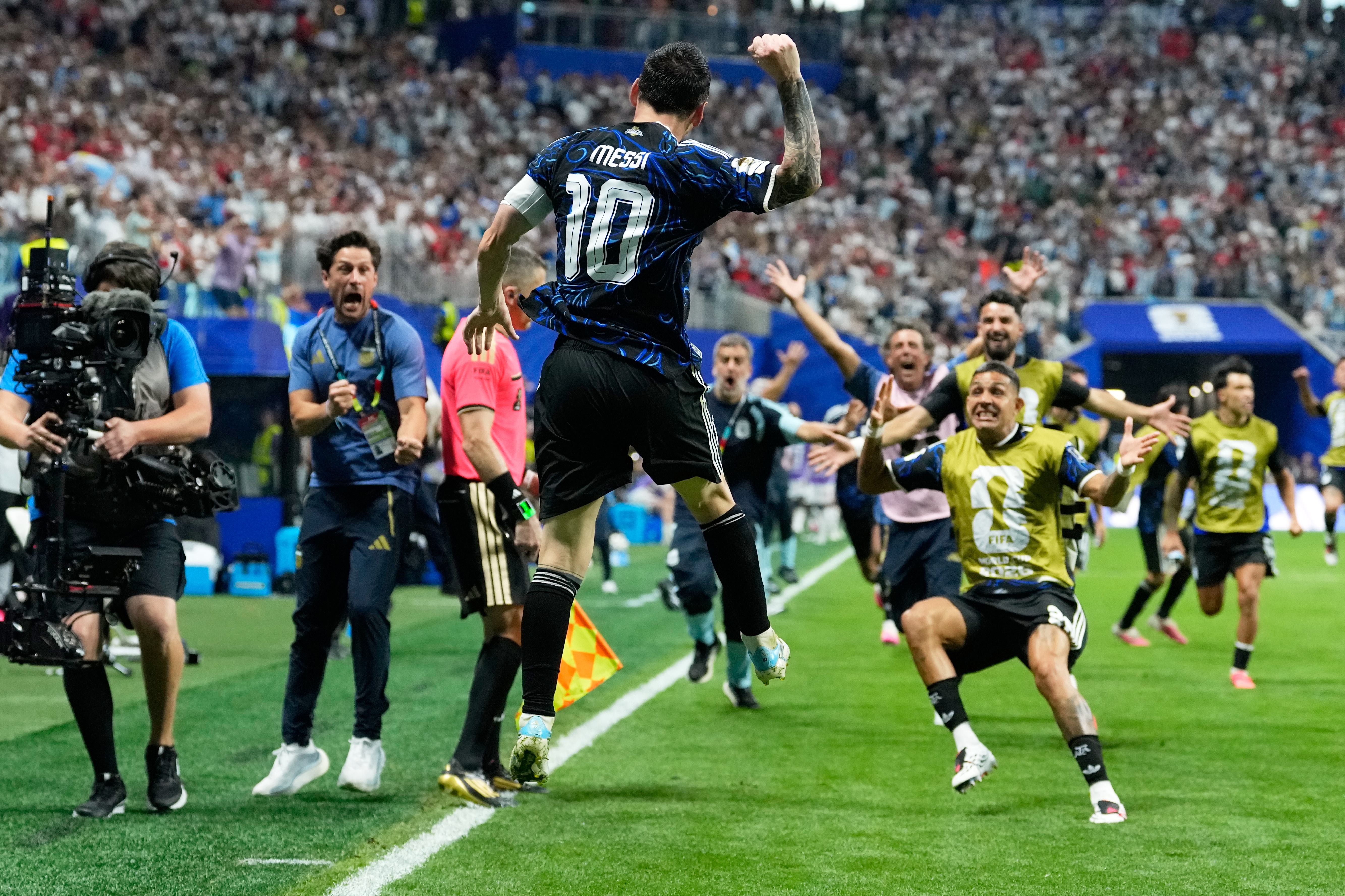 Argentina's Lionel Messi celebrates after teammate Lautaro Martinez scored their side's second goal during the World Cup semifinal soccer match between England and Argentina in Atlanta, Wednesday, July 15, 2026. 