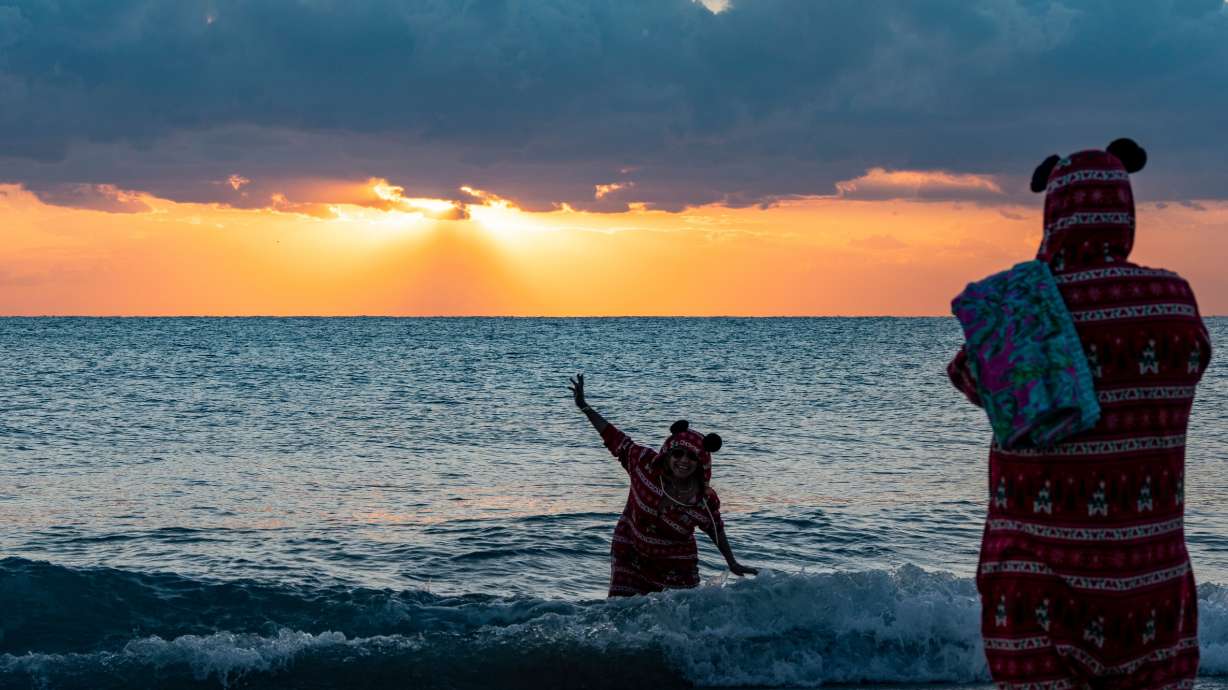 Margaret Marin, left, poses for photos by her son Alejandro Leon in matching pajamas on Christmas morning 2025, in Palm Beach, Fla. It probably won't come as a surprise that weather was the top reason Americans cited for moving to another state in a new survey.