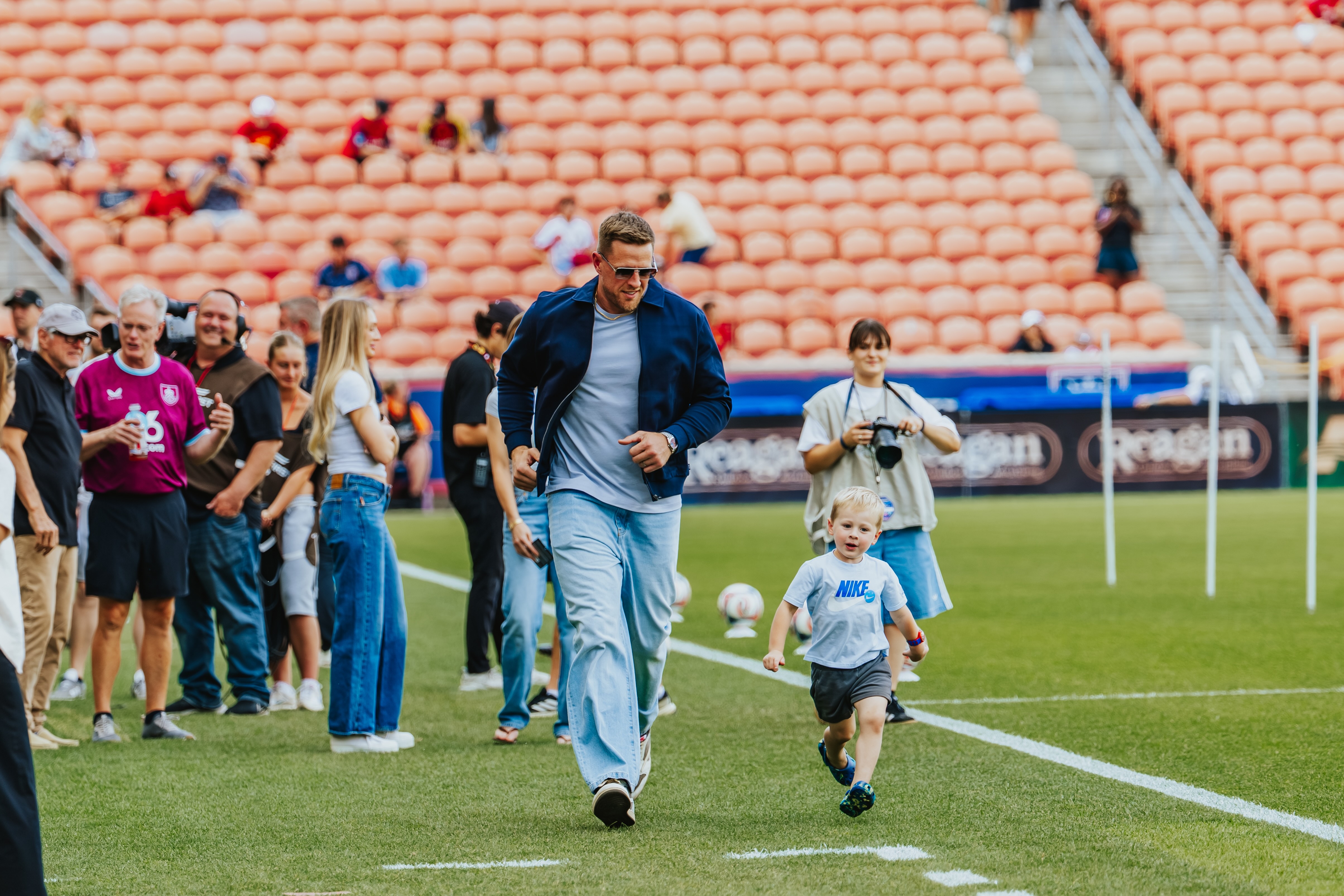 Former NFL star and Burnley FC investor J.J. Watt plays with his children before Real Salt Lake's 4-1 win over Burnley FC in an international friendly, Wednesday, July 15, 2026 at America First Field in Sandy, Utah.