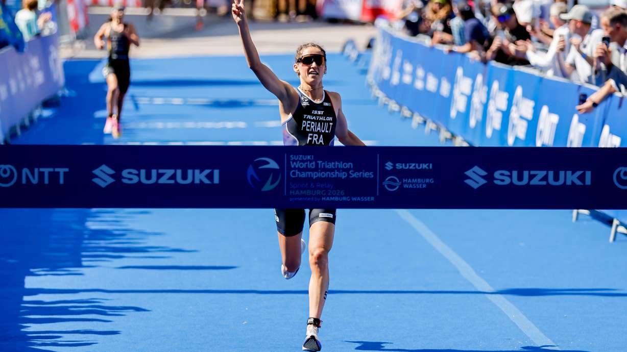 France's Leonie Periault celebrates winning the woman's ITU World Triathlon Series/World Championship race in Hamburg, Germany, Saturday, July 11, 2026.