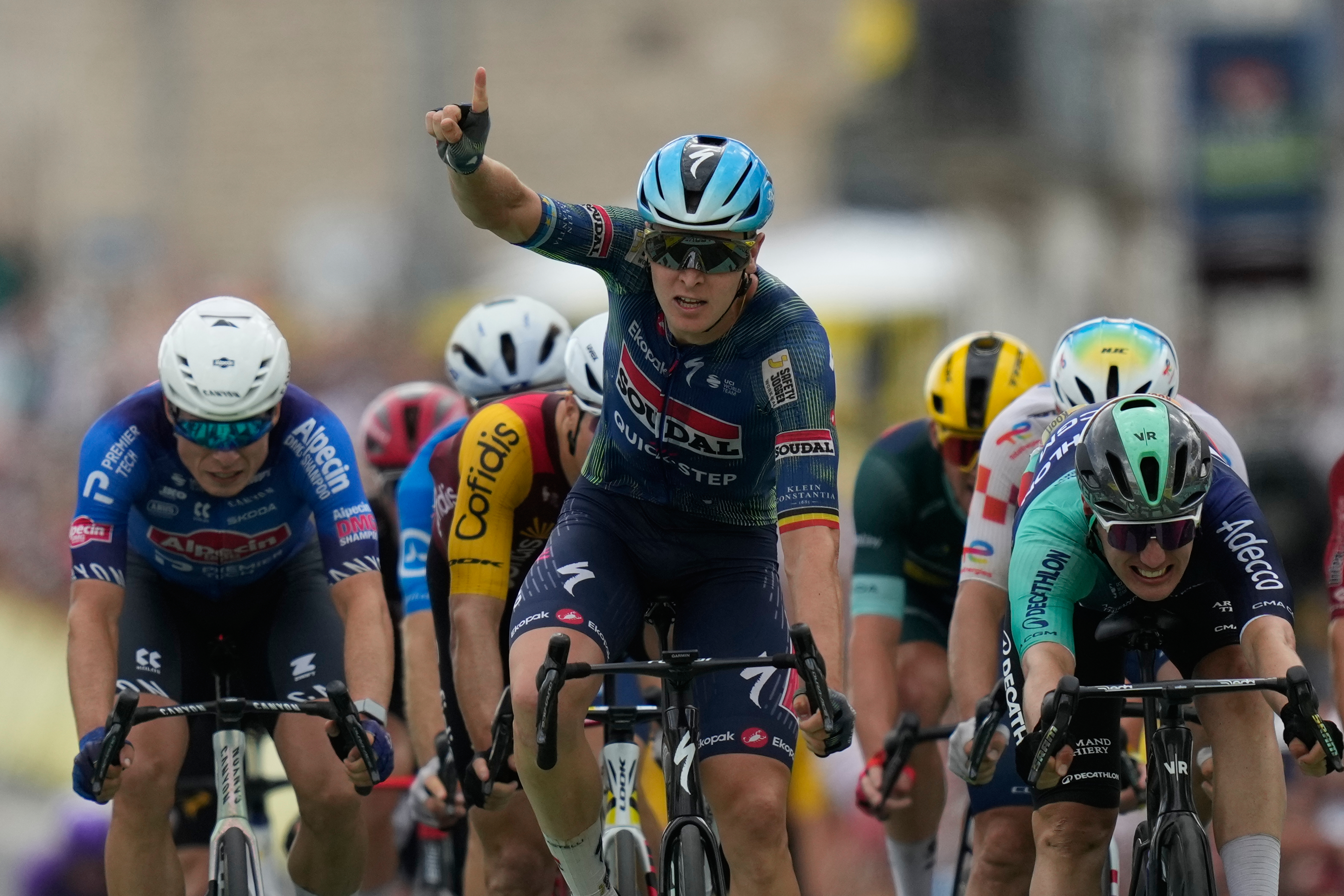 Belgium's Tim Merlier celebrates as he crosses the finish line to win the twelfth stage of the Tour de France cycling race with start in Circuit Nevers Magny-Cours and finish in Chalon-sur-Saone, France, Thursday, July 16, 2026. 