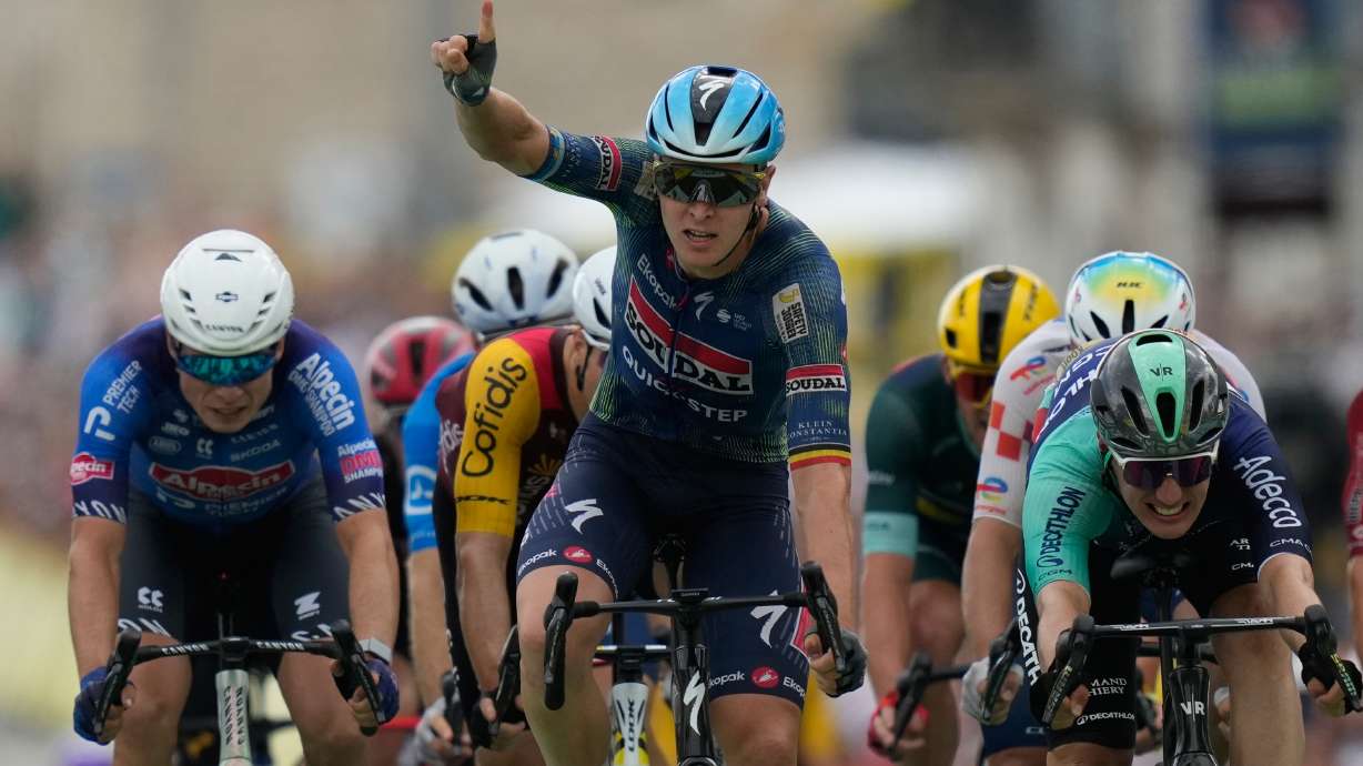 Belgium's Tim Merlier celebrates as he crosses the finish line to win the twelfth stage of the Tour de France cycling race with start in Circuit Nevers Magny-Cours and finish in Chalon-sur-Saone, France, Thursday, July 16, 2026.