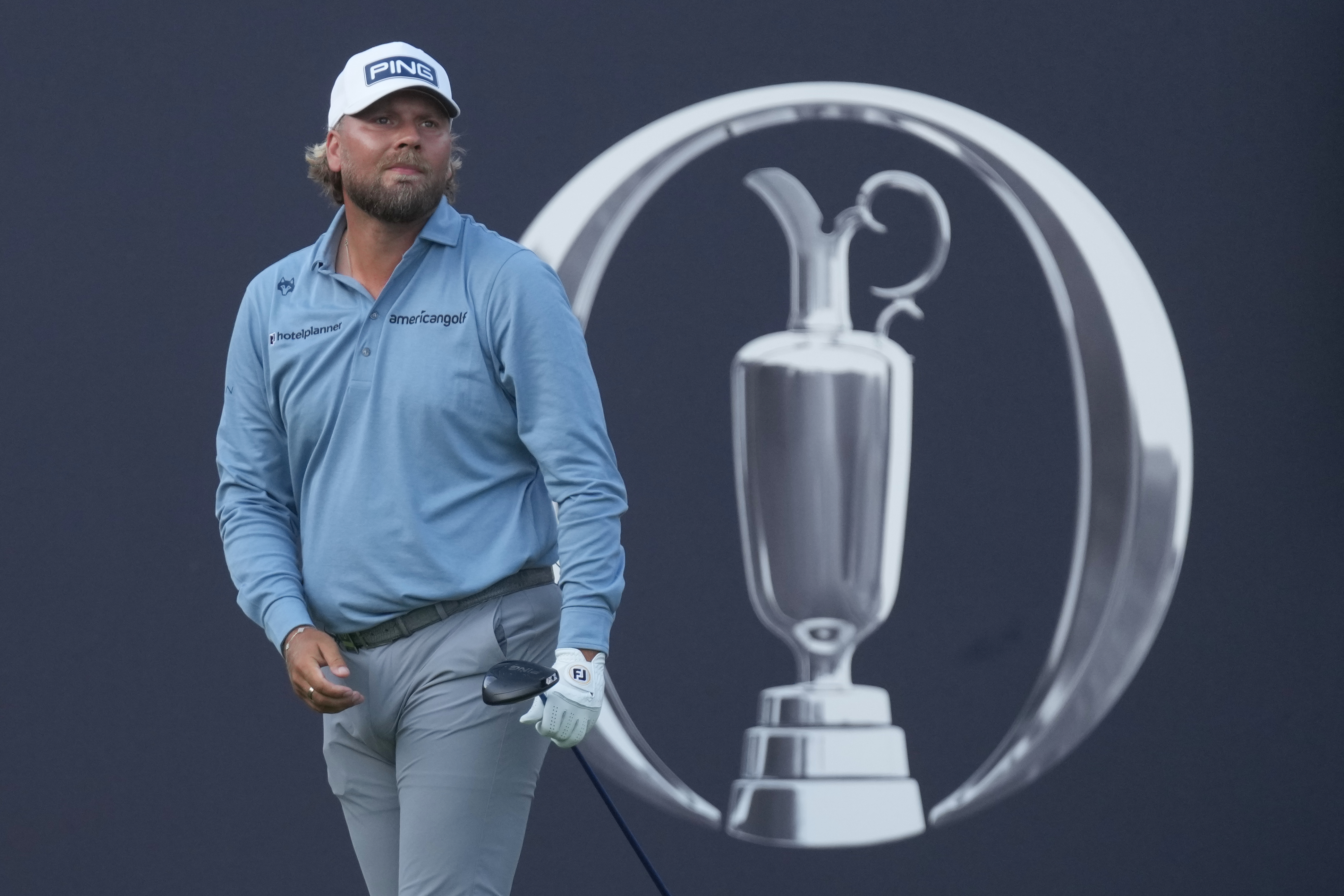 Daniel Brown of England watches where his shot has landed after playing off the 1st tee during the first day of the British Open Golf championships at Royal Birkdale golf club, in Southport, England, Thursday, July 16, 2026. 