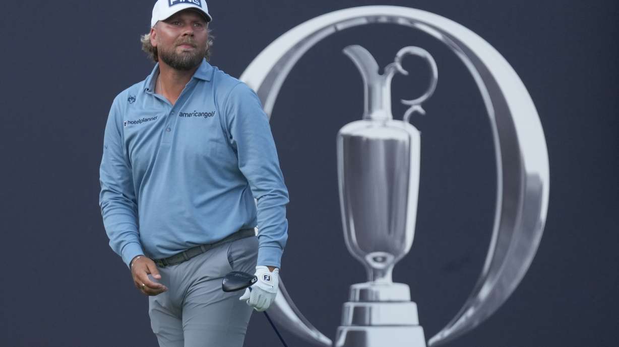Daniel Brown of England watches where his shot has landed after playing off the 1st tee during the first day of the British Open Golf championships at Royal Birkdale golf club, in Southport, England, Thursday, July 16, 2026.