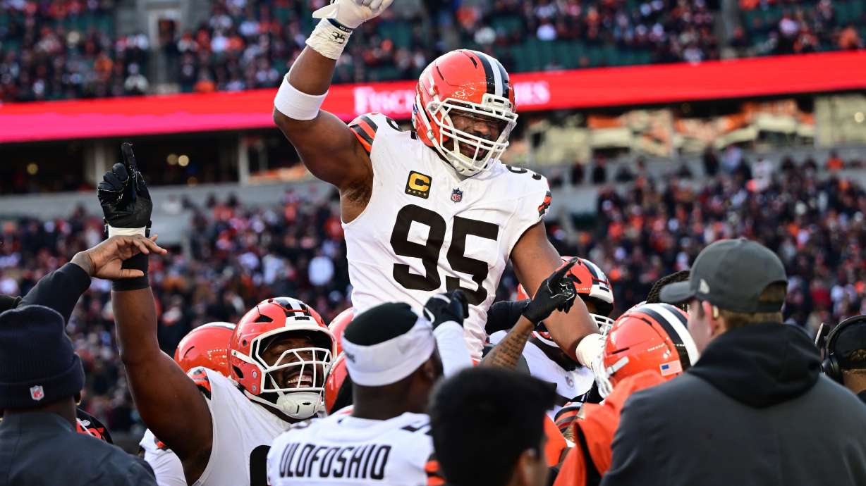 FILE - Cleveland Browns defensive end Myles Garrett, center, celebrates with teammates after breaking the NFL single season sack record during the second half of an NFL football game against the Cincinnati Bengals in Cincinnati, Jan. 4, 2026.