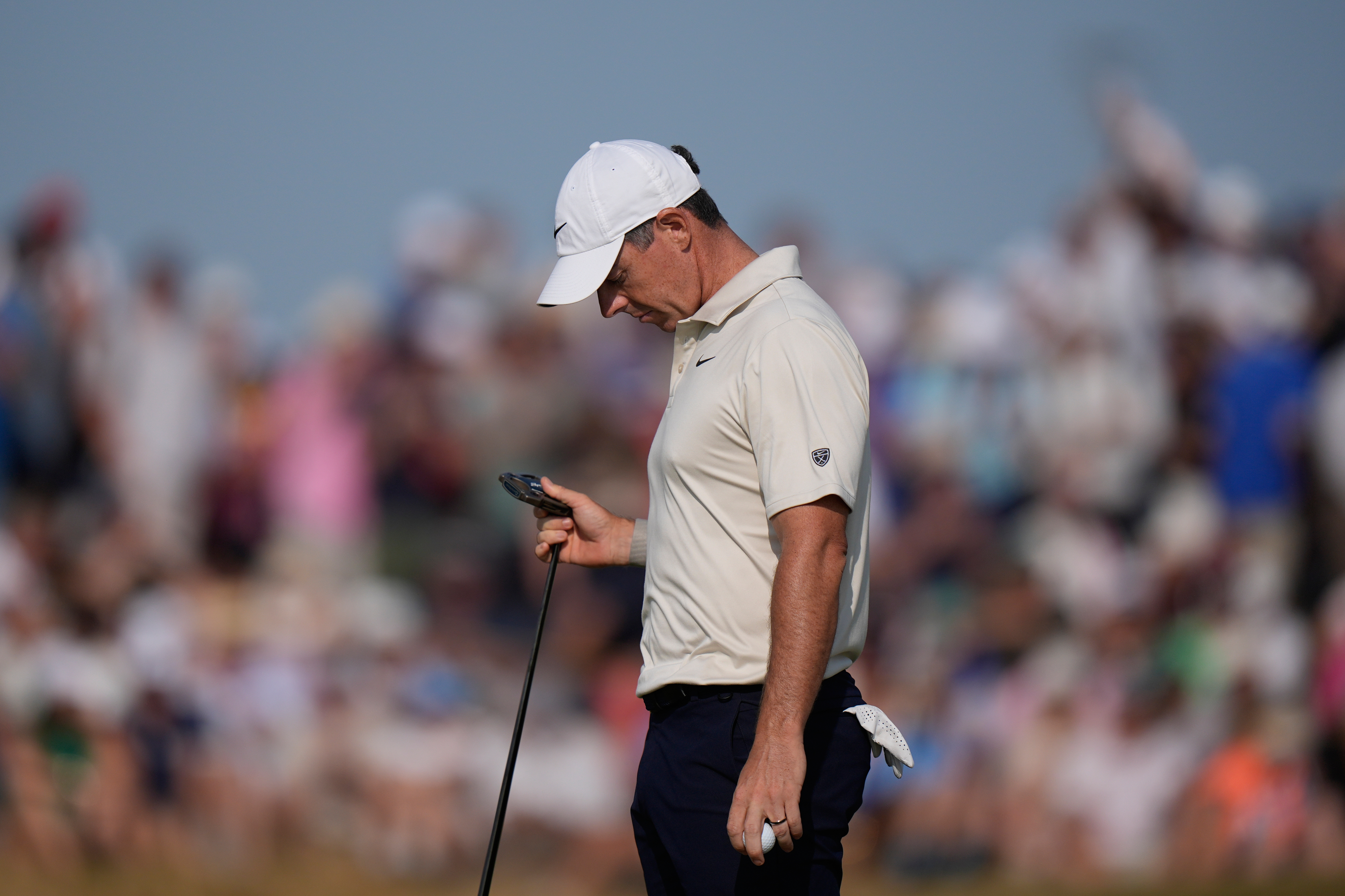 Rory McIlroy of Northern Ireland looks at his club after putting on the 9th green during the first day of the British Open Golf championships at Royal Birkdale golf club, in Southport, England, Thursday, July 16, 2026. 