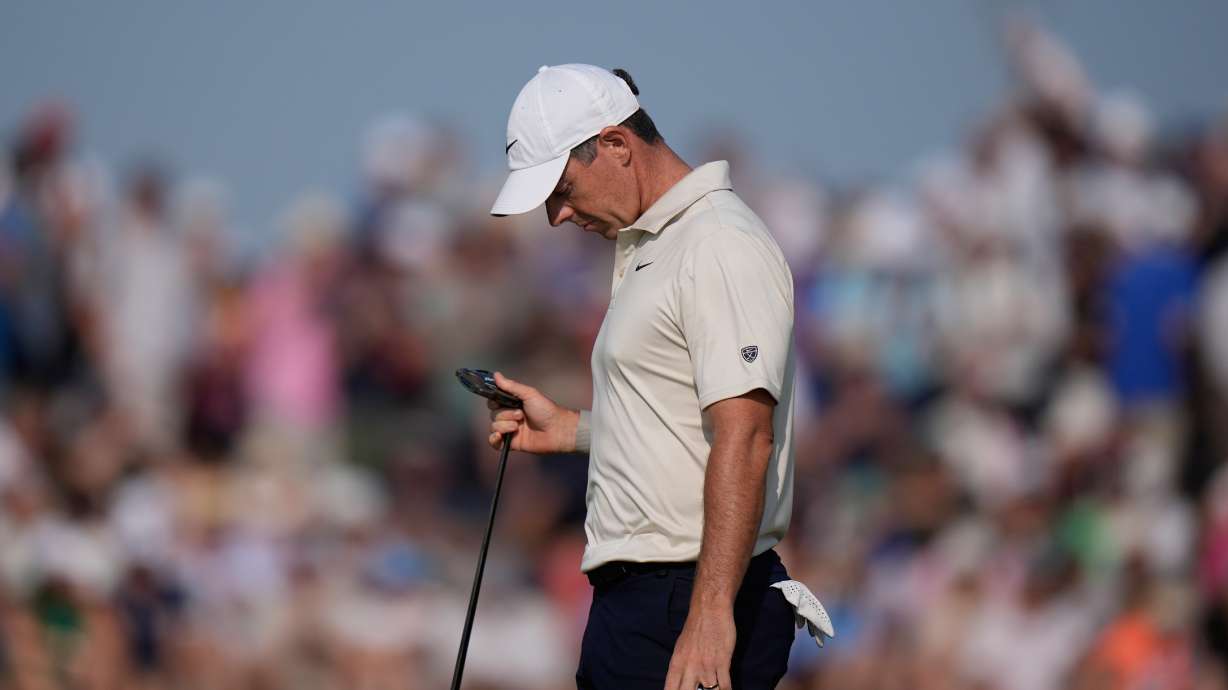 Rory McIlroy of Northern Ireland looks at his club after putting on the 9th green during the first day of the British Open Golf championships at Royal Birkdale golf club, in Southport, England, Thursday, July 16, 2026.