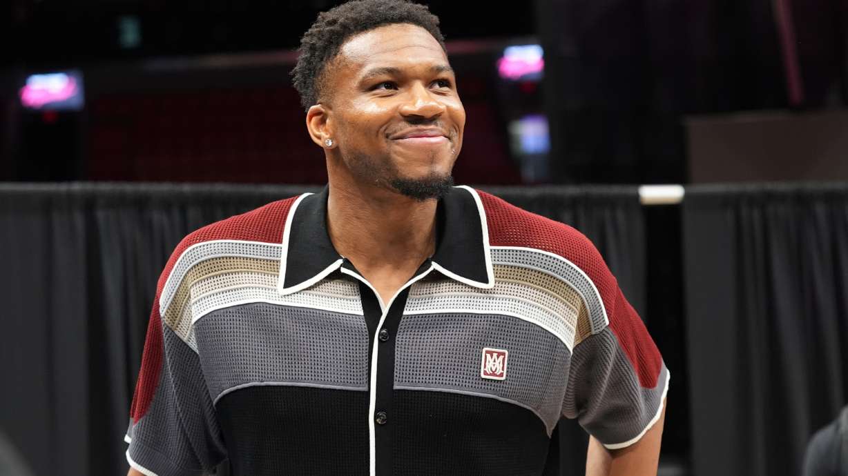 Giannis Antetokounmpo smiles after a news conference where he was introduced as a new Miami Heat player Thursday, July 16, 2026, in Miami.