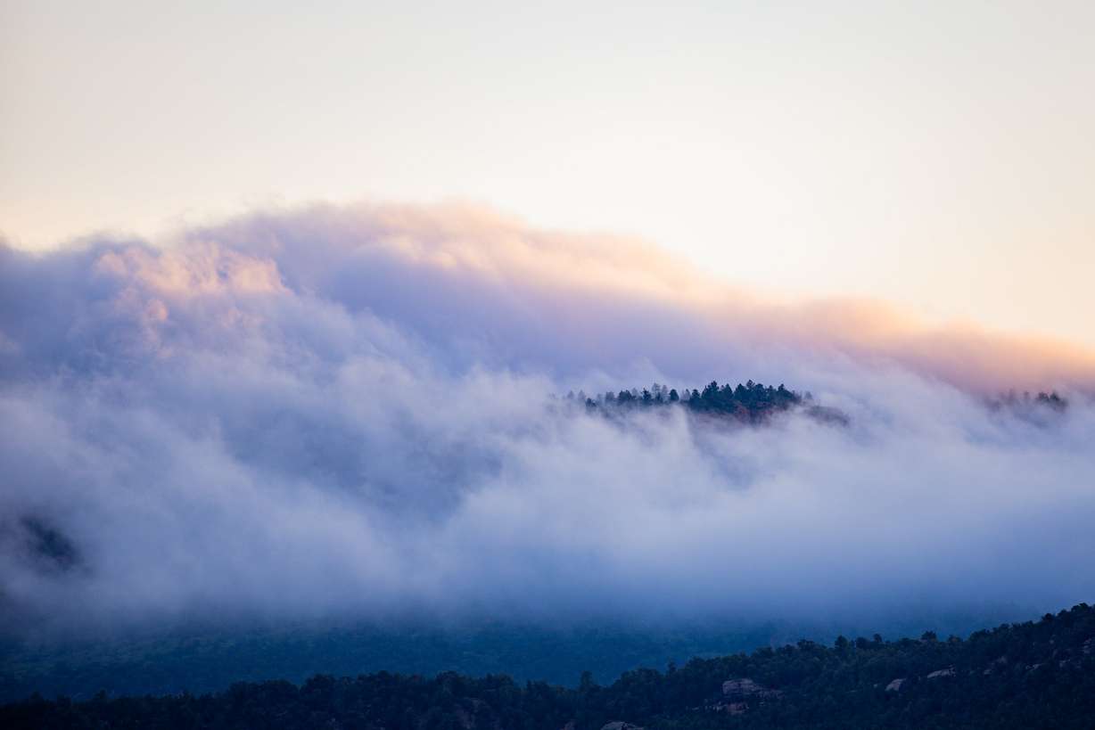 Fog envelops the Bears Ears buttes at sunrise at Bears Ears National Monument on June 4, 2025. Shrinking monuments are not as potentially damaging as some people think, according to experts.
