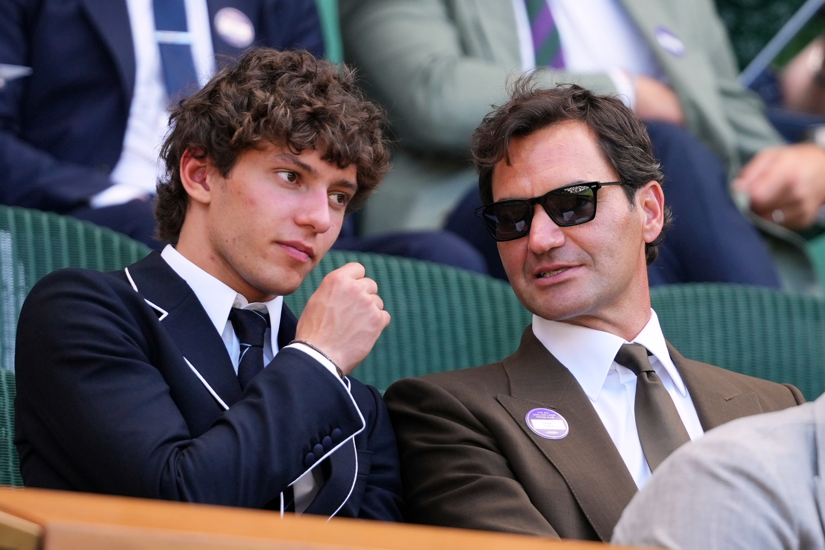 F1 Mercedes driver Andrea Kimi Antonelli of Italy sits beside former tennis player Roger Federer of Switzerland in the Royal Box on day eight at the Wimbledon Tennis Championships in London, Monday, July 6, 2026.