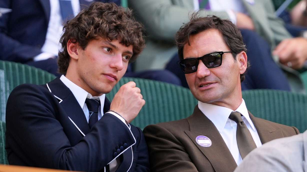 F1 Mercedes driver Andrea Kimi Antonelli of Italy sits beside former tennis player Roger Federer of Switzerland in the Royal Box on day eight at the Wimbledon Tennis Championships in London, Monday, July 6, 2026.