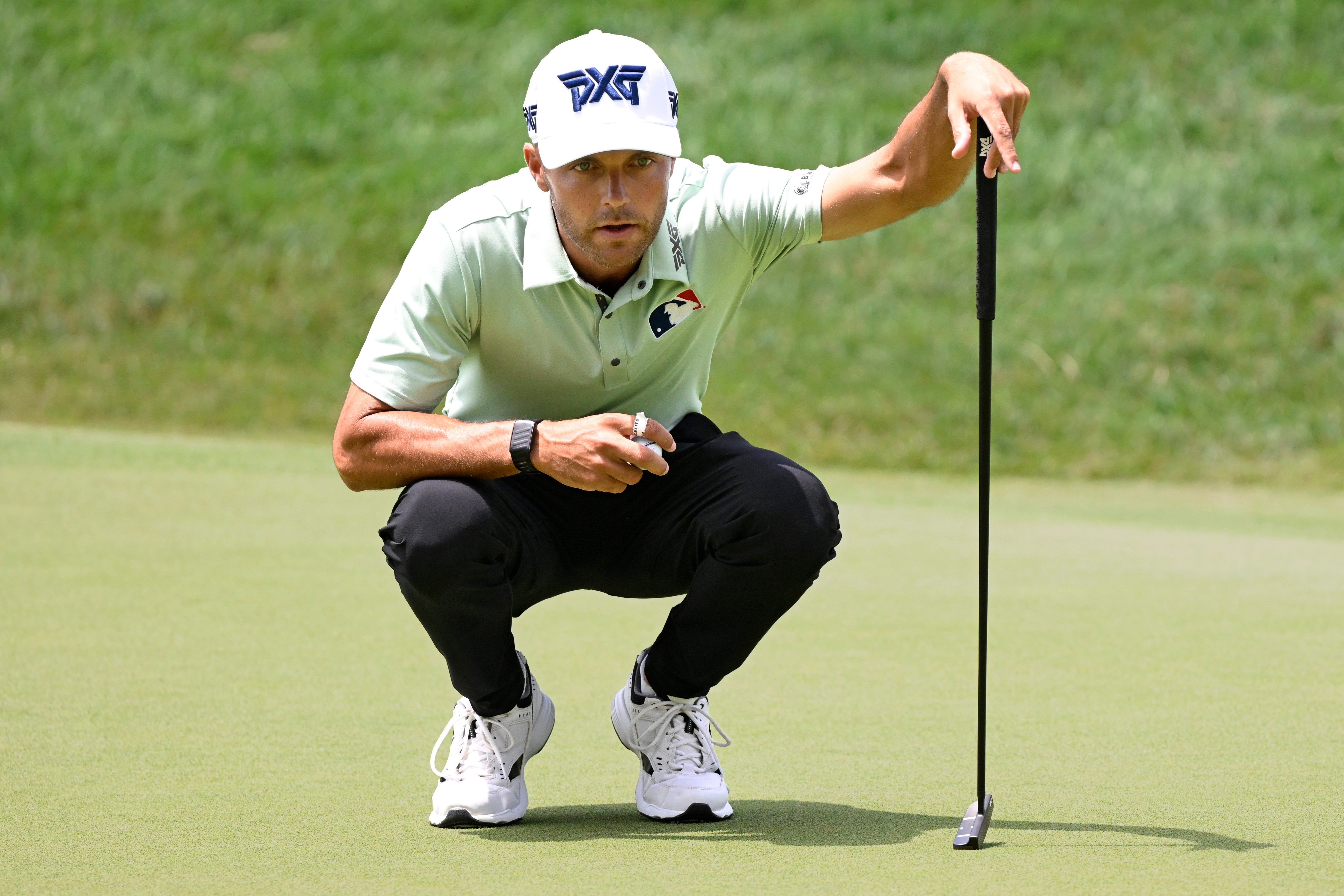 Eric Cole lines up his putt on the 18th green during the first round of the Travelers Championship golf tournament at TPC River Highlands, Thursday, June 25, 2026, in Cromwell, Conn. 