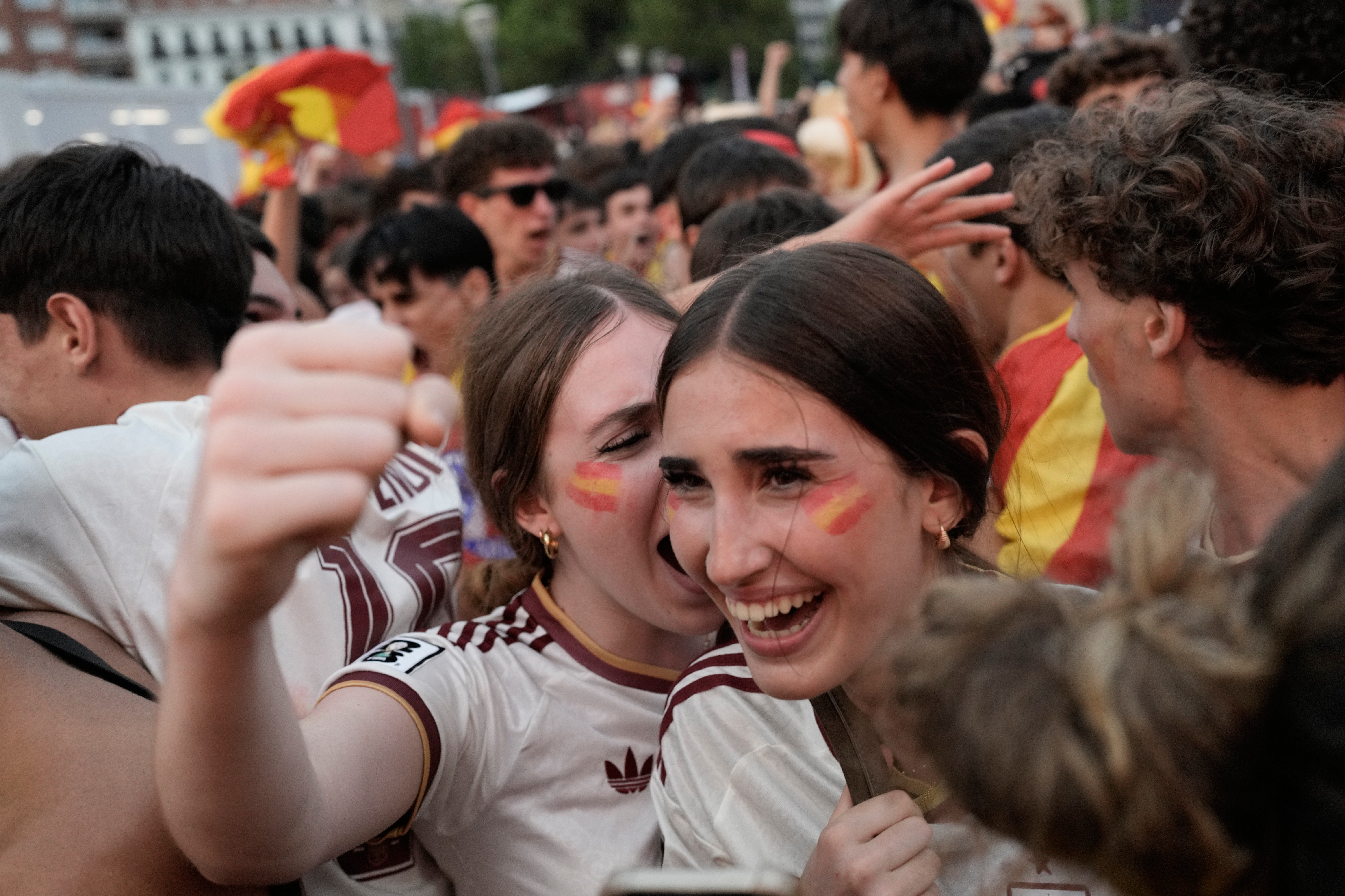 Spanish fans celebrate in central Madrid after Spain's Mikel Oyarzabal scores the opening goal on a penalty kick during the World Cup semifinal soccer match between France and Spain in Arlington, Texas, near Dallas, Tuesday, July 14, 2026. 