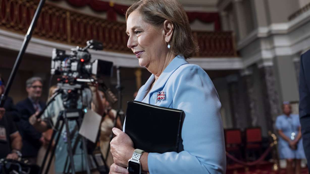 Newly-sworn Sen. Darline Graham, R-S.C., sister of Lindsey Graham, walks past cameras as she leaves the Old Senate Chamber following a ceremonial oath of office ceremony allowing her to serve as her late brother's temporary replacement, at the Capitol in Washington, Tuesday.