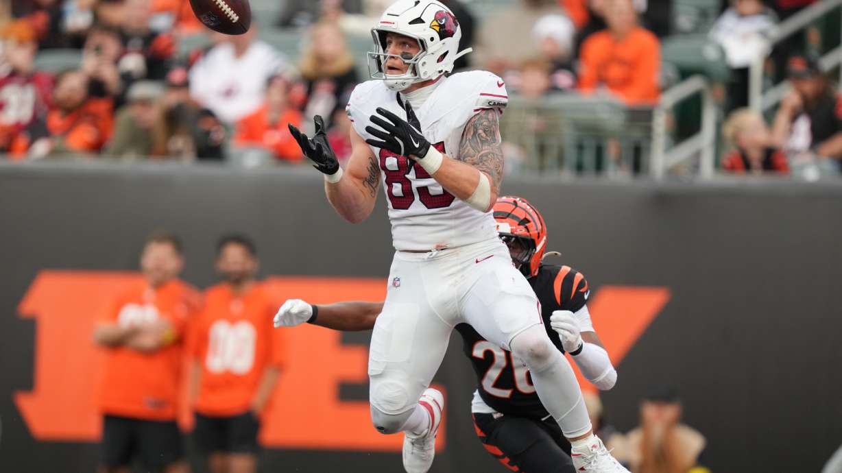 FILE - Arizona Cardinals tight end Trey McBride (85) catches a touchdown pass in the end zone during the second half of an NFL football game against the Cincinnati Bengals, Dec. 28, 2025, in Cincinnati.