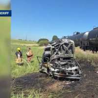 Man pulls teenage brothers from burning car after train crash