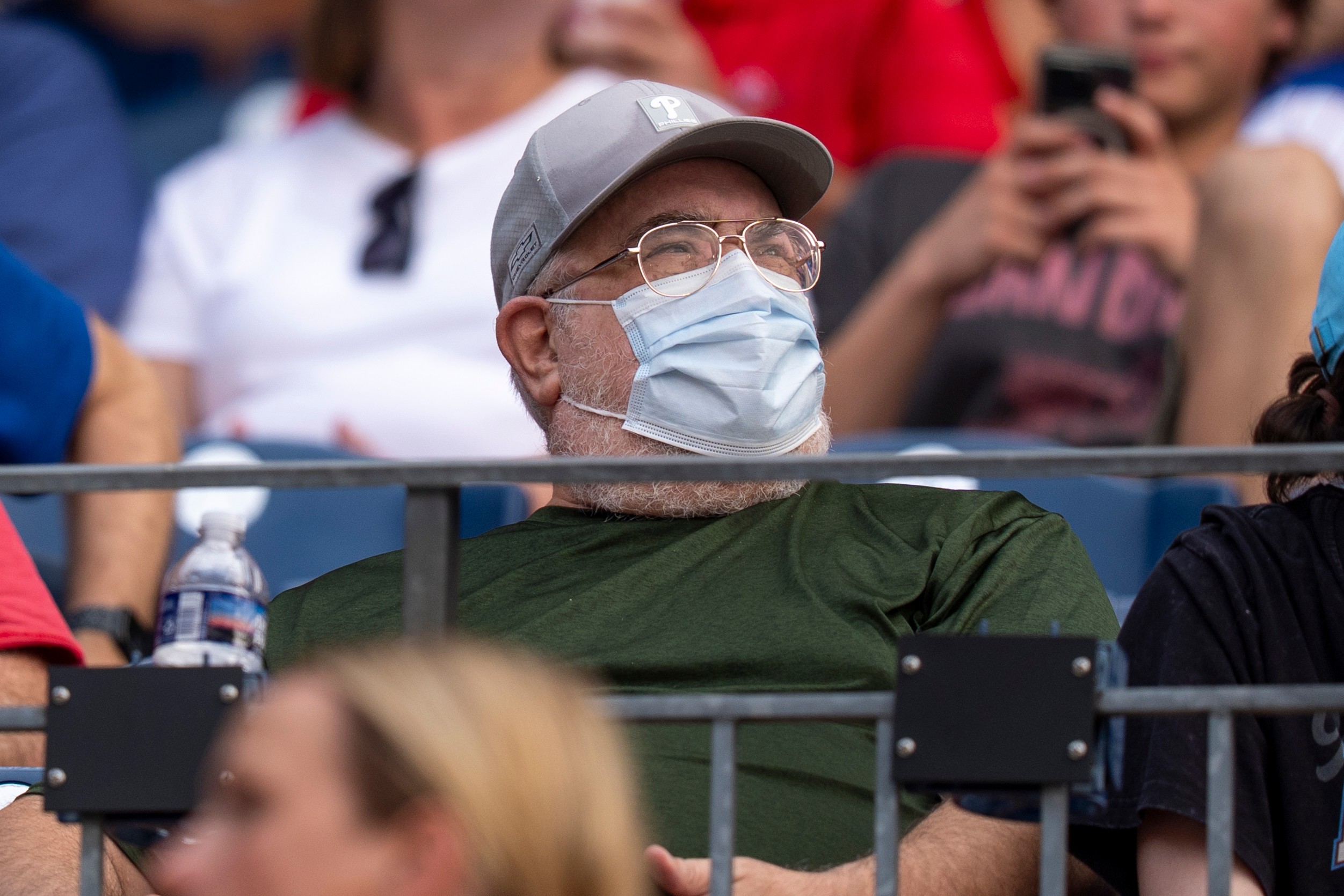 A fan wears a mask during an air quality warning from wildfire smoke prior to baseball game between the New York Mets and the Philadelphia Phillies, Thursday, July 16, 2026, in Philadelphia. 