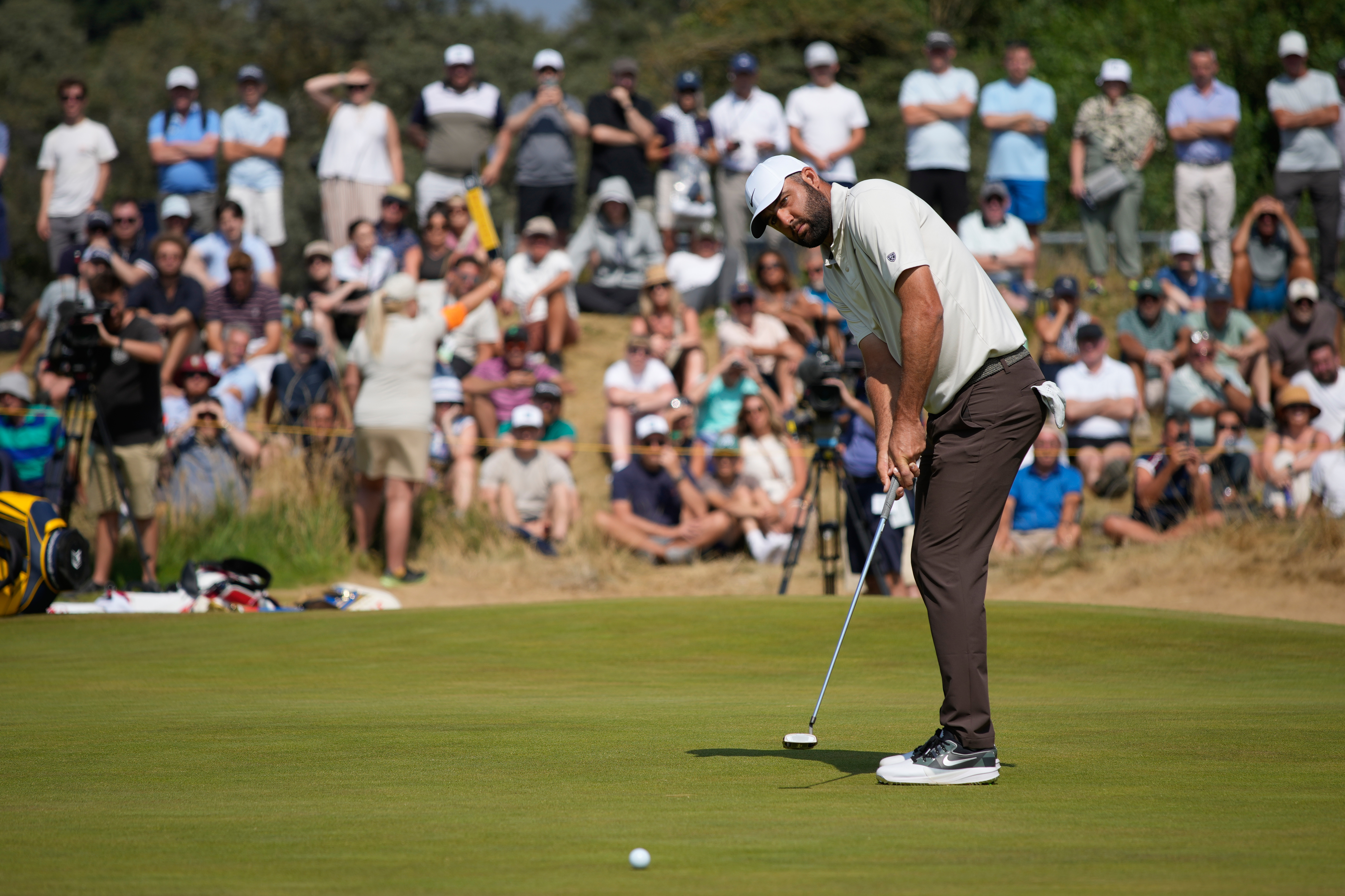 Scottie Scheffler of the United States putts on the 1st green during the second day of the British Open Golf championships at Royal Birkdale golf club, in Southport, England, Friday, July 17, 2026. 