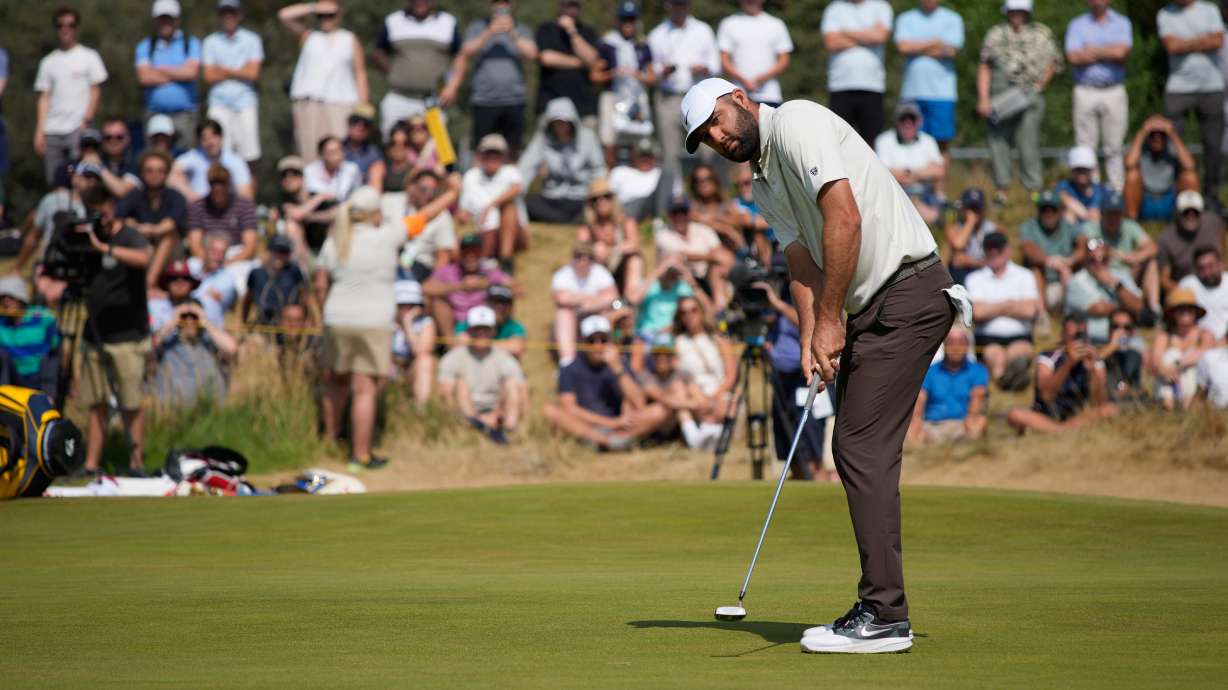 Scottie Scheffler of the United States putts on the 1st green during the second day of the British Open Golf championships at Royal Birkdale golf club, in Southport, England, Friday, July 17, 2026.