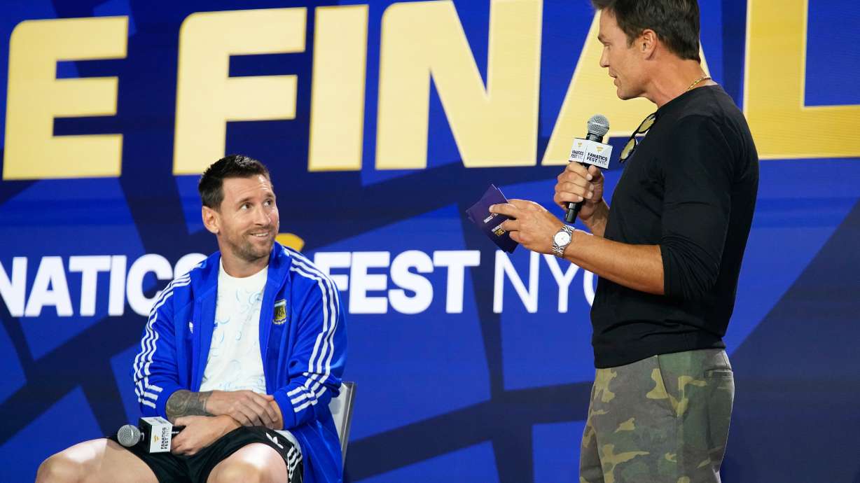 Argentina's Lionel Messi listens to former NFL player Tom Brady during a news conference ahead of the World Cup final soccer match between Spain and Argentina in New York, Friday, July 17, 2026.