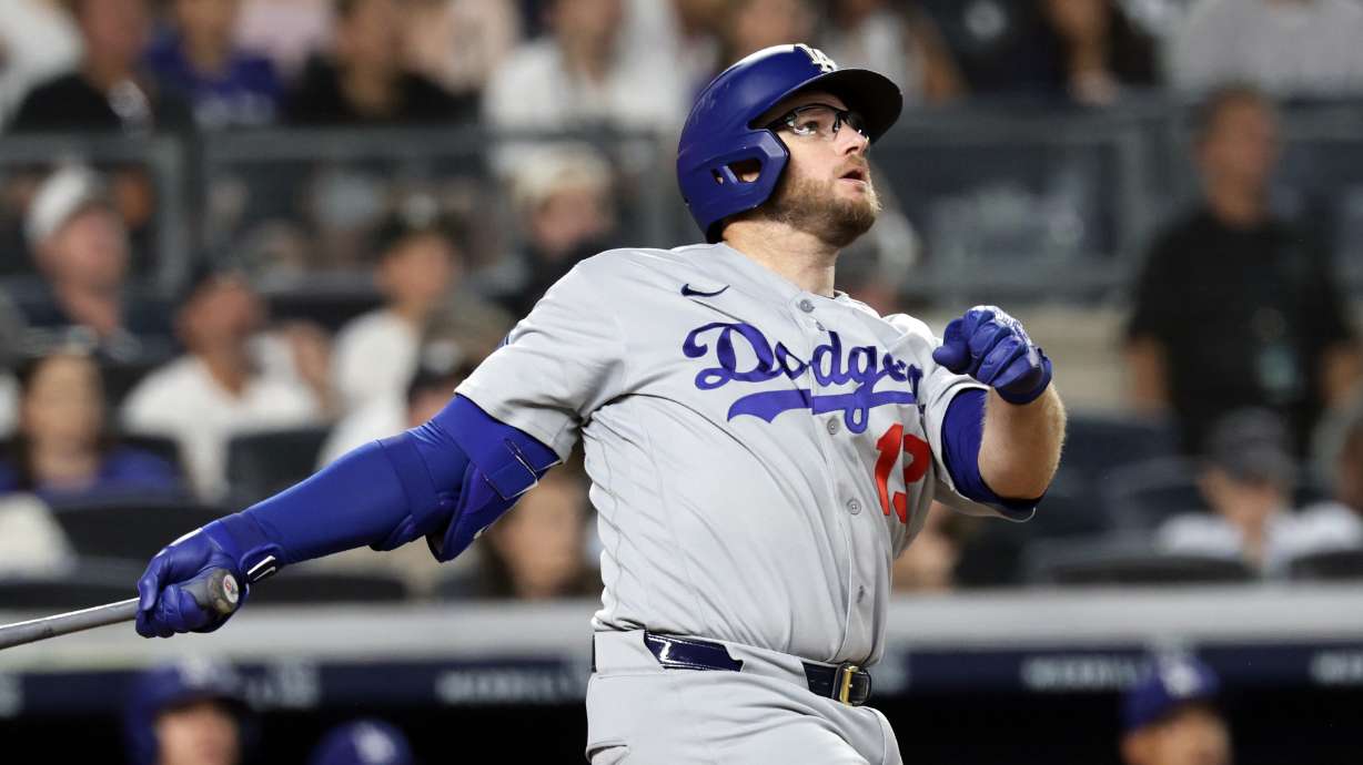 Los Angeles Dodgers' Max Muncy watches his two-run home run during the seventh inning of a baseball game against the New York Yankees, Friday, July 17, 2026, in New York.