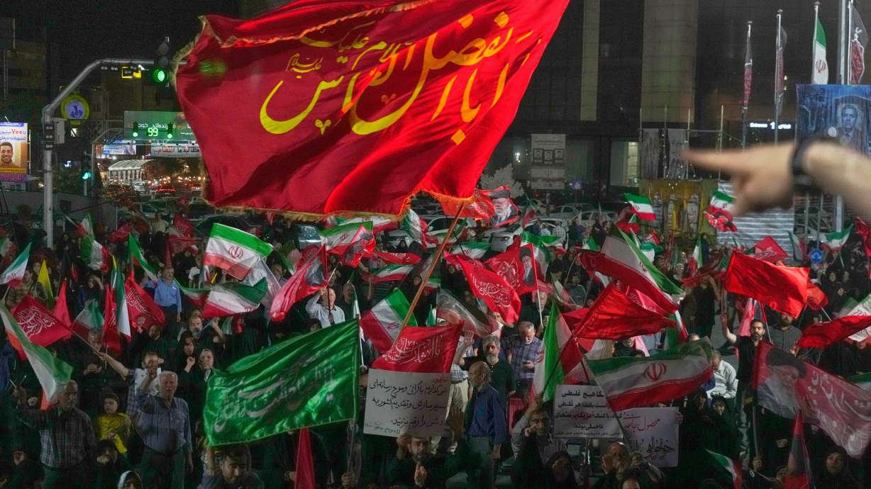 Pro-government demonstrators gather at a square in Tehran, Friday.