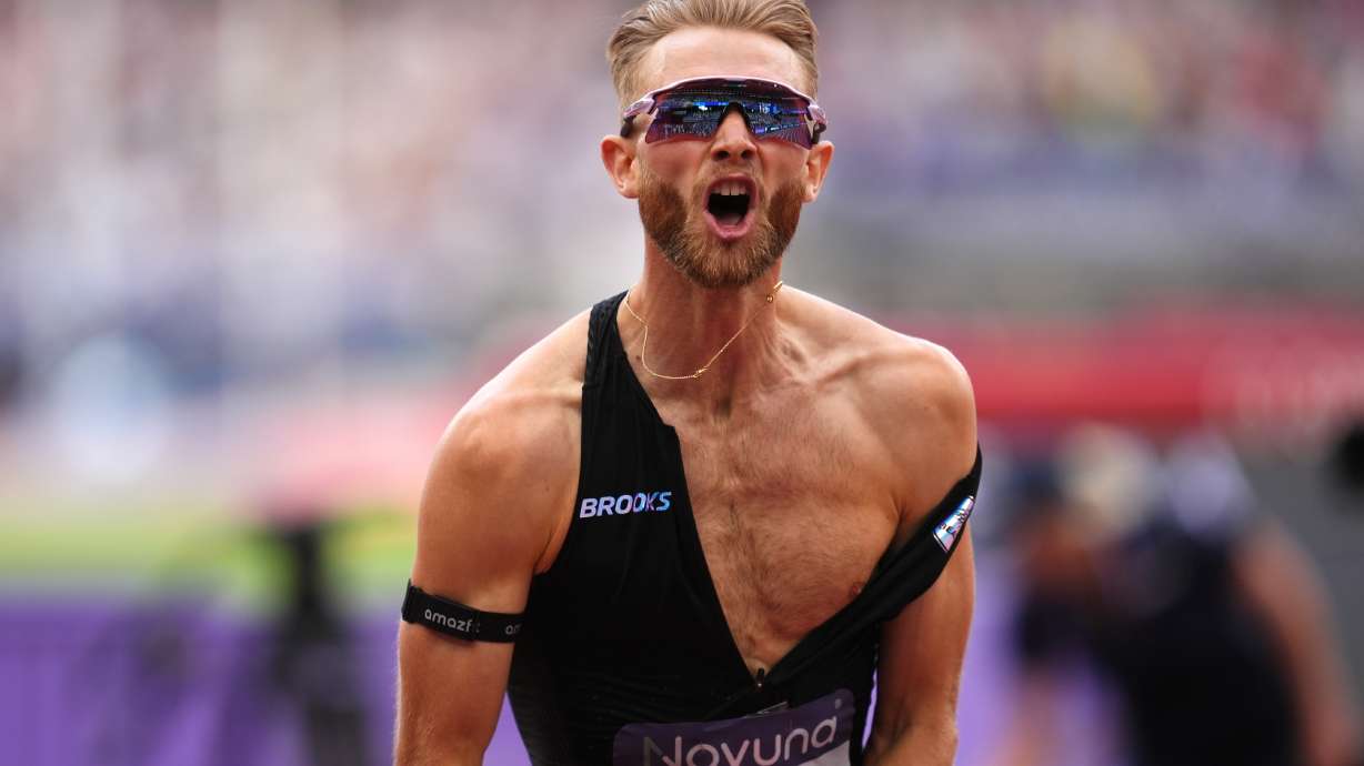 Britain's Josh Kerr celebrates after winning and breaking a world record in the Men's 1 Mile final during the Novuna London Athletics Meet at the London Stadium, Saturday July 18, 2026.