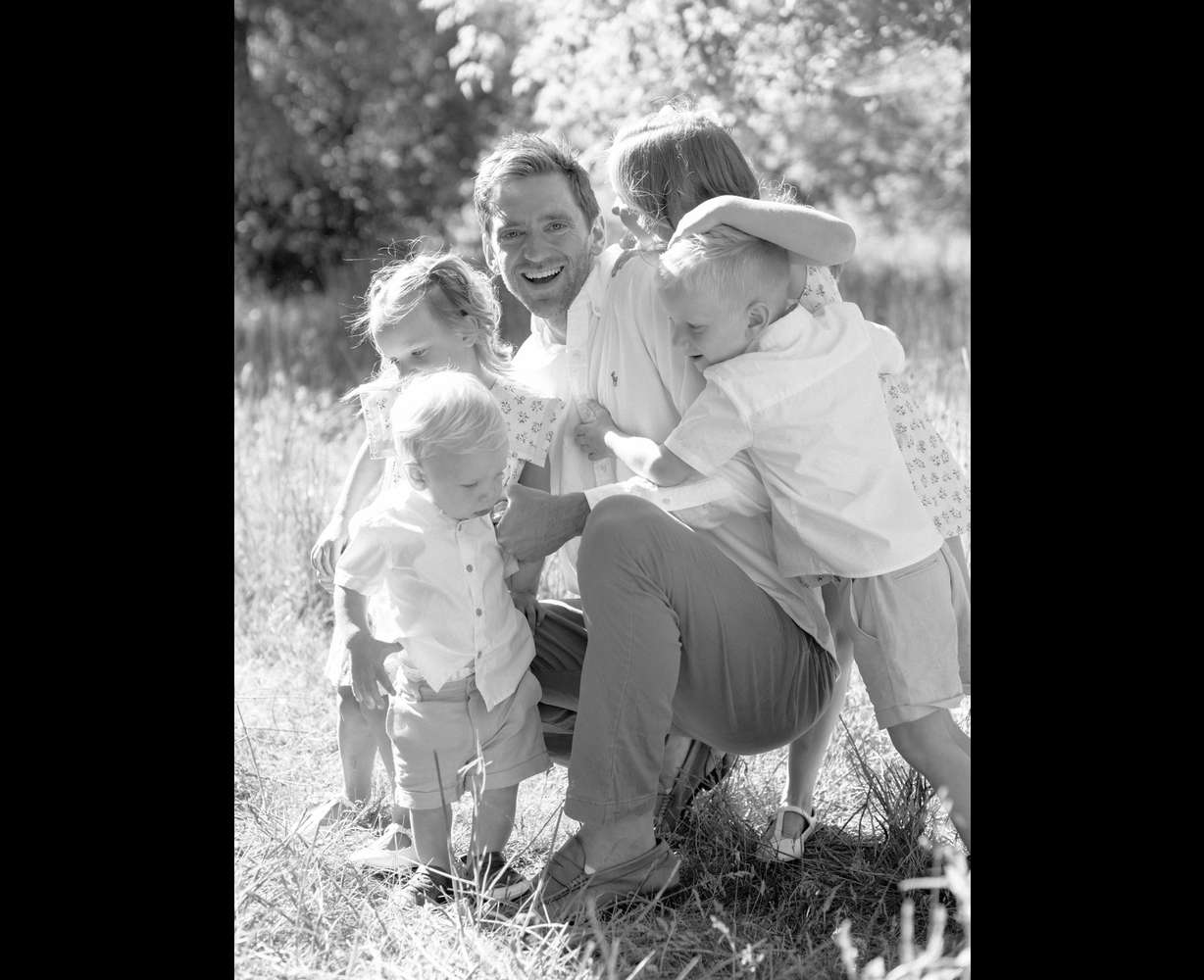 Ben Wilson with his four kids. The Wilson family is hoping to give back after they received overwhelming community support for Ben Wilson's cancer treatment.