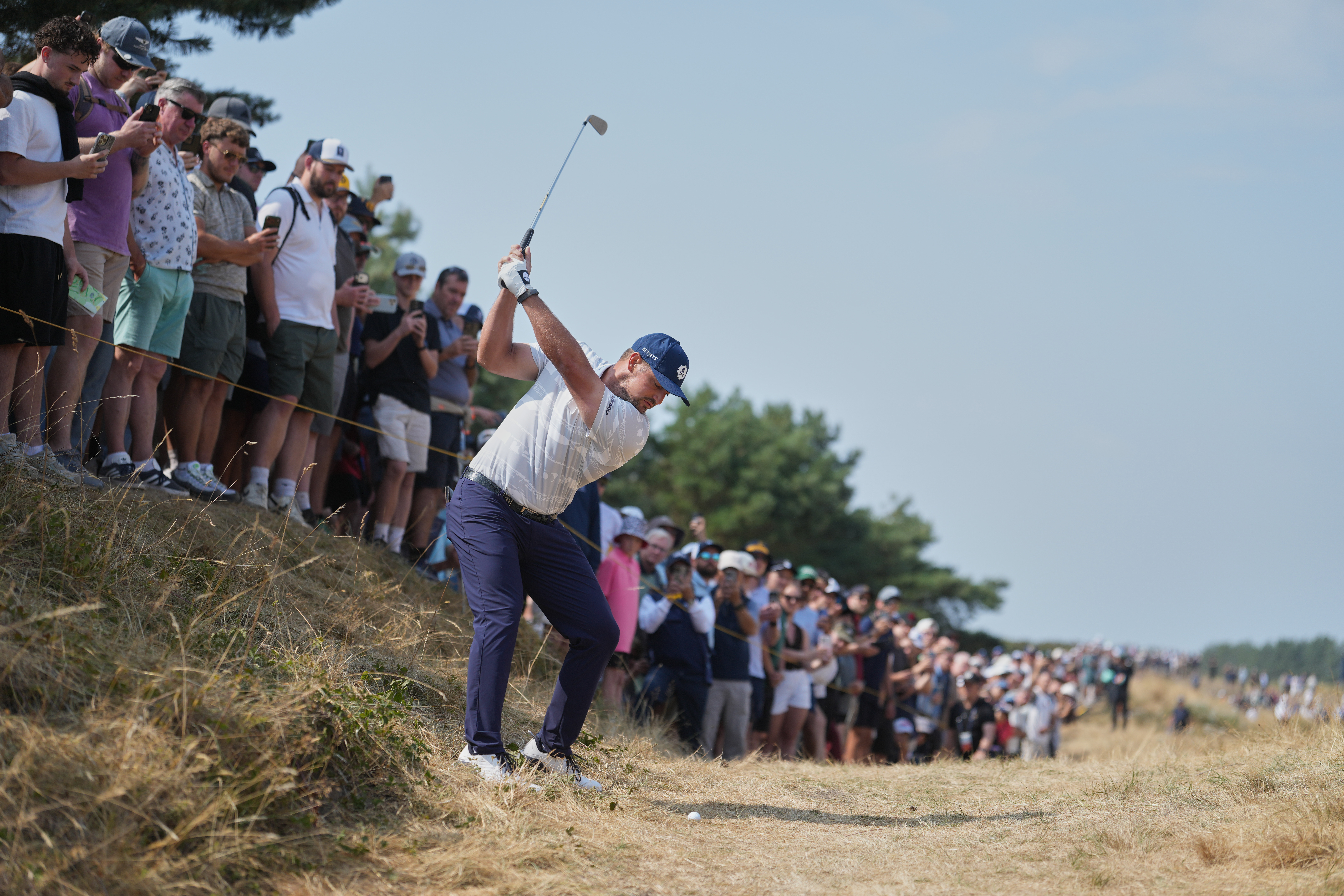 Bryson DeChambeau of the United States plays from the rough on the 1st hole during the third day of the British Open Golf championships at Royal Birkdale golf club, in Southport, England, Saturday, July 18, 2026. 
