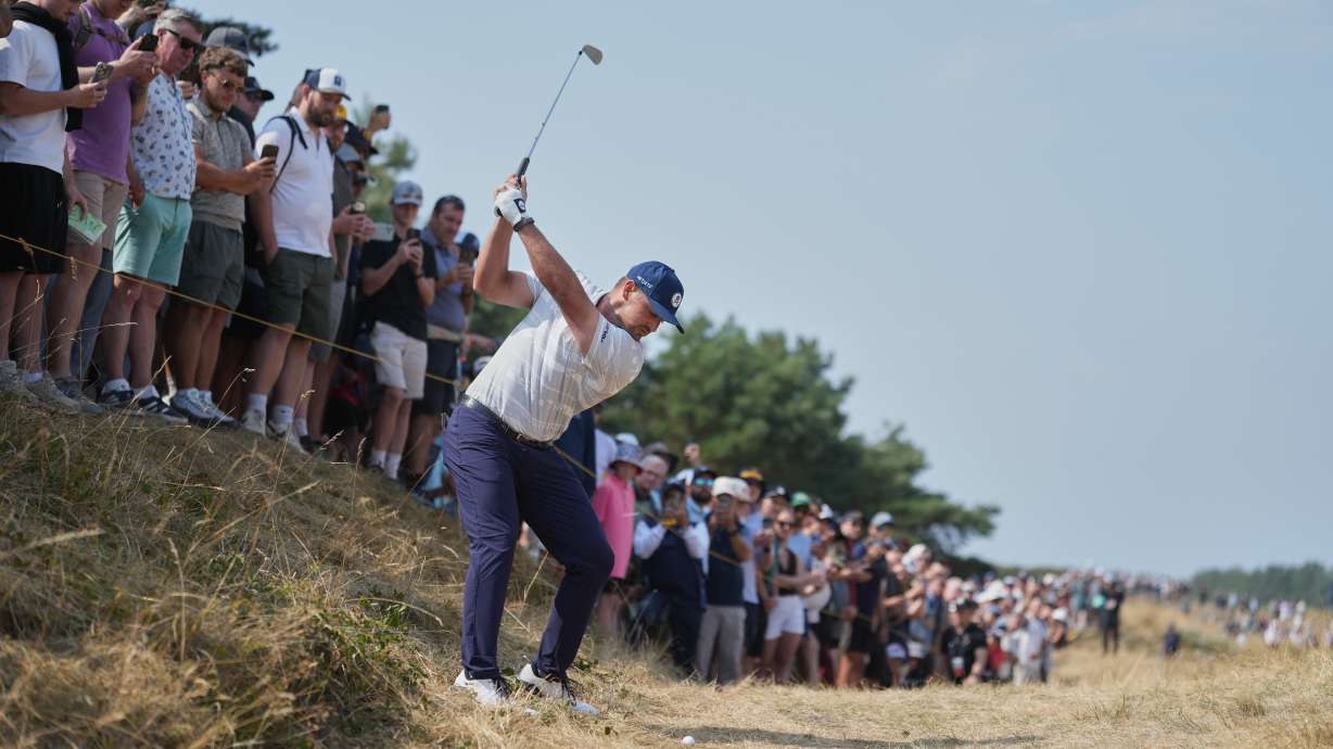 Bryson DeChambeau of the United States plays from the rough on the 1st hole during the third day of the British Open Golf championships at Royal Birkdale golf club, in Southport, England, Saturday, July 18, 2026.
