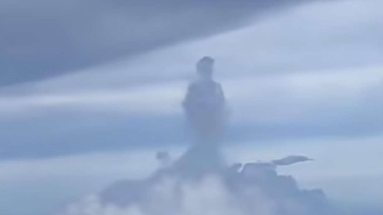 A passenger on an airplane captures a cloud formation of what appears to be a man waiting for a ride on May 24, in Hefei, China.