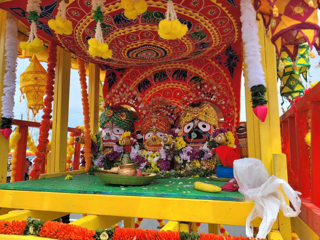 From left to right, Lord Balabhadra, Sister Subhadra and Lord Jagannath sit in their chariot as part of the Ratha Yatra Festival in Kearns on Saturday.