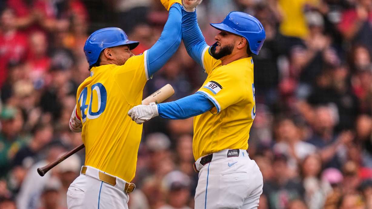 Boston Red Sox's Wilyer Abreu, right, is congratulated by Willson Contreras after hitting a solo home run in the third inning of a baseball game against the Tampa Bay Rays, Saturday, July 18, 2026, in Boston.