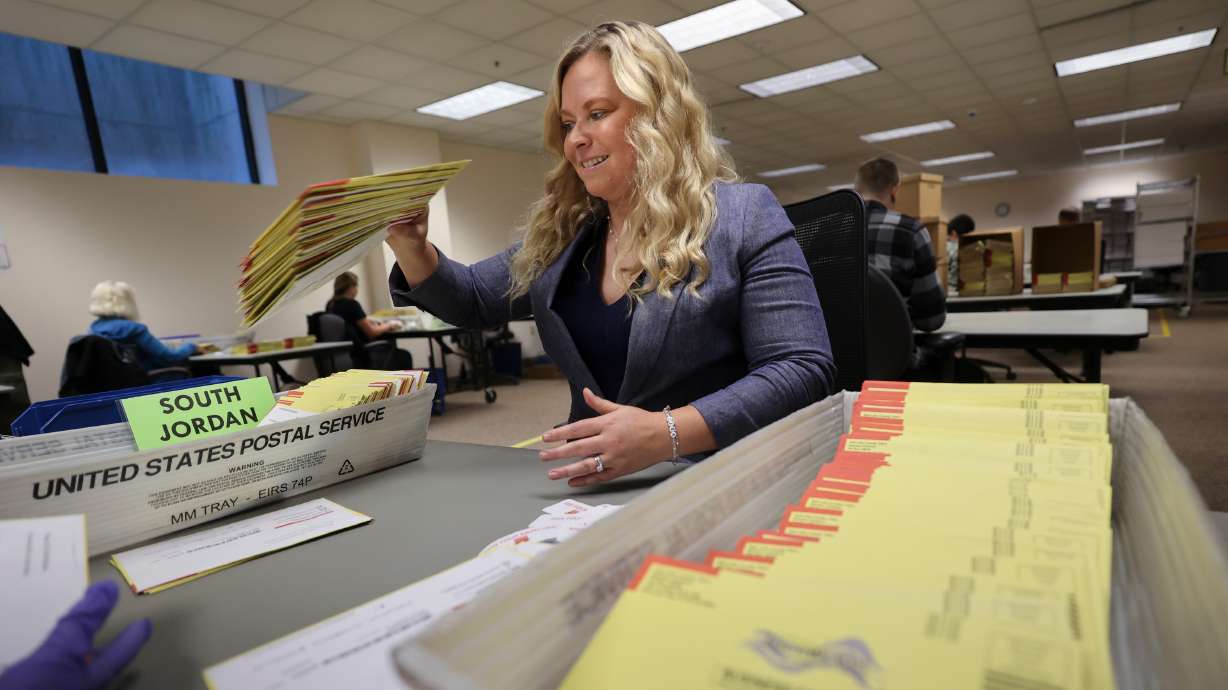 County Clerk Lannie Chapman tabs primary election ballot envelopes at the Salt Lake County Government Center in Salt Lake City on June 24, 2024. Sen. Mike Lee said mail-in voting should be restricted in future elections.