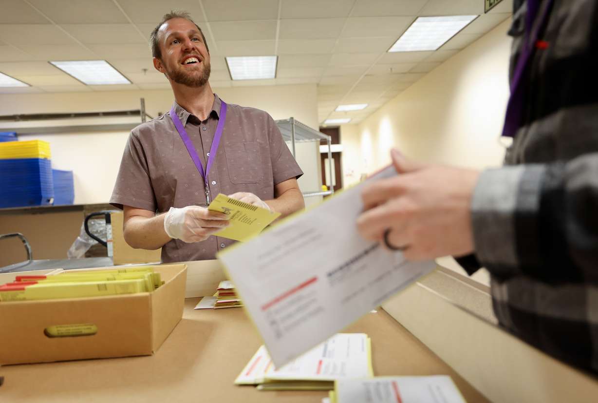 Timothy Schorzman, Salt Lake County Clerk’s Office elections asset manager, tabs primary election ballot envelopes to expose signatures at the Salt Lake County Government Center in Salt Lake City on Monday, June 24, 2024.