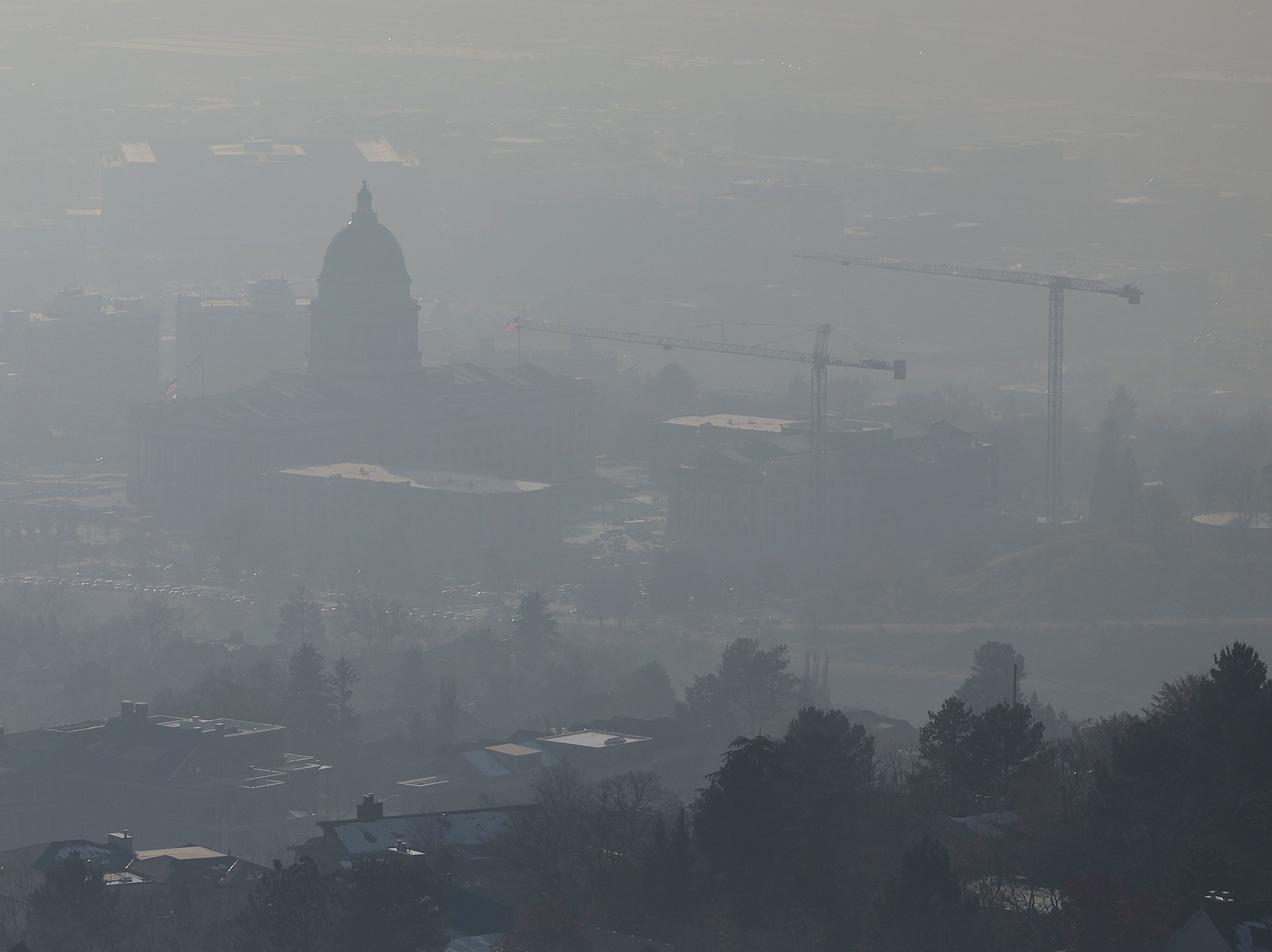 The state Capitol, as seen from the Bonneville Shoreline Trail, during an inversion in Salt Lake City on Dec. 5, 2024. A new University of Utah study showed a link between preterm births and air quality in Utah.