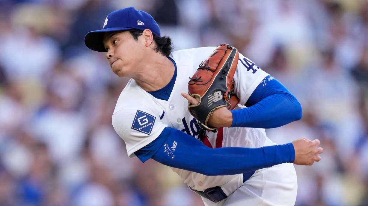 Los Angeles Dodgers starting pitcher Shohei Ohtani throws to the plate during the first inning of a baseball game against the San Diego Padres, Friday, July 3, 2026, in Los Angeles.