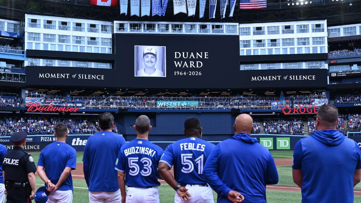 Players and coaches of the Toronto Blue Jays recognize a moment of silence on the announcement of the passing of former Blue Jays pitcher Duane Ward prior to the start of the game against the Chicago White Sox in MLB baseball action in Toronto on Sunday, July 19, 2026.