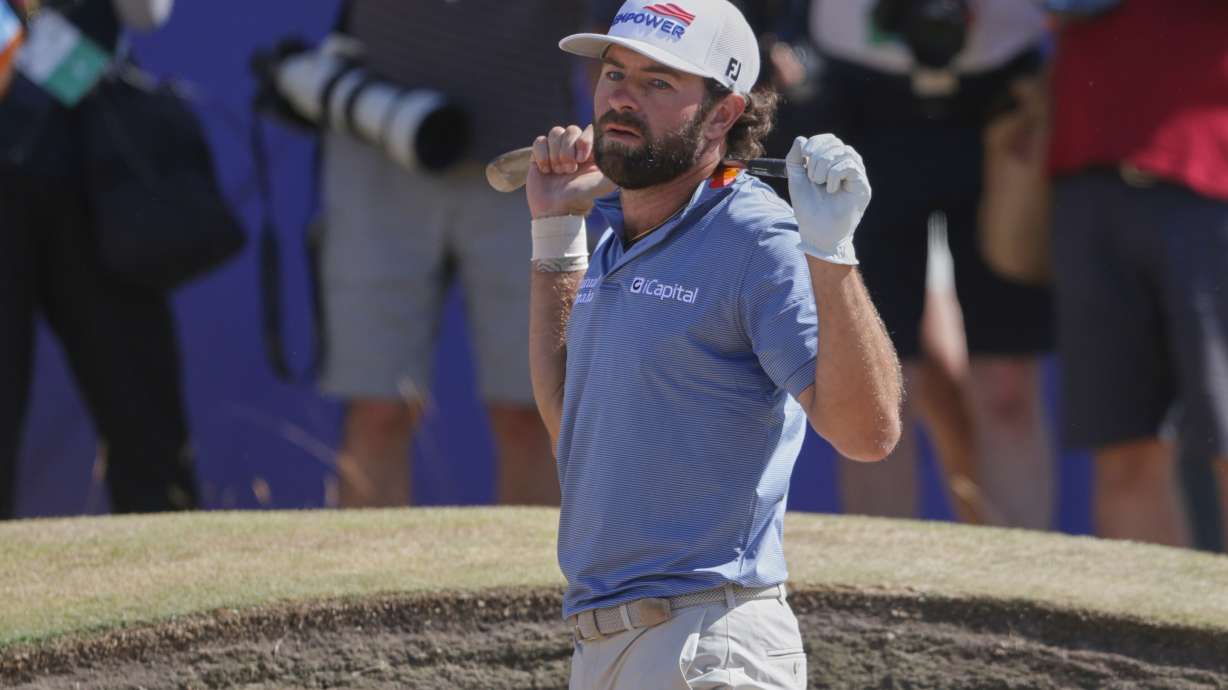 Cameron Young of the United States reacts after playing out of a bunker on the 18th green during the final day of the British Open Golf championships at Royal Birkdale golf club, in Southport, England, Sunday, July 19, 2026.