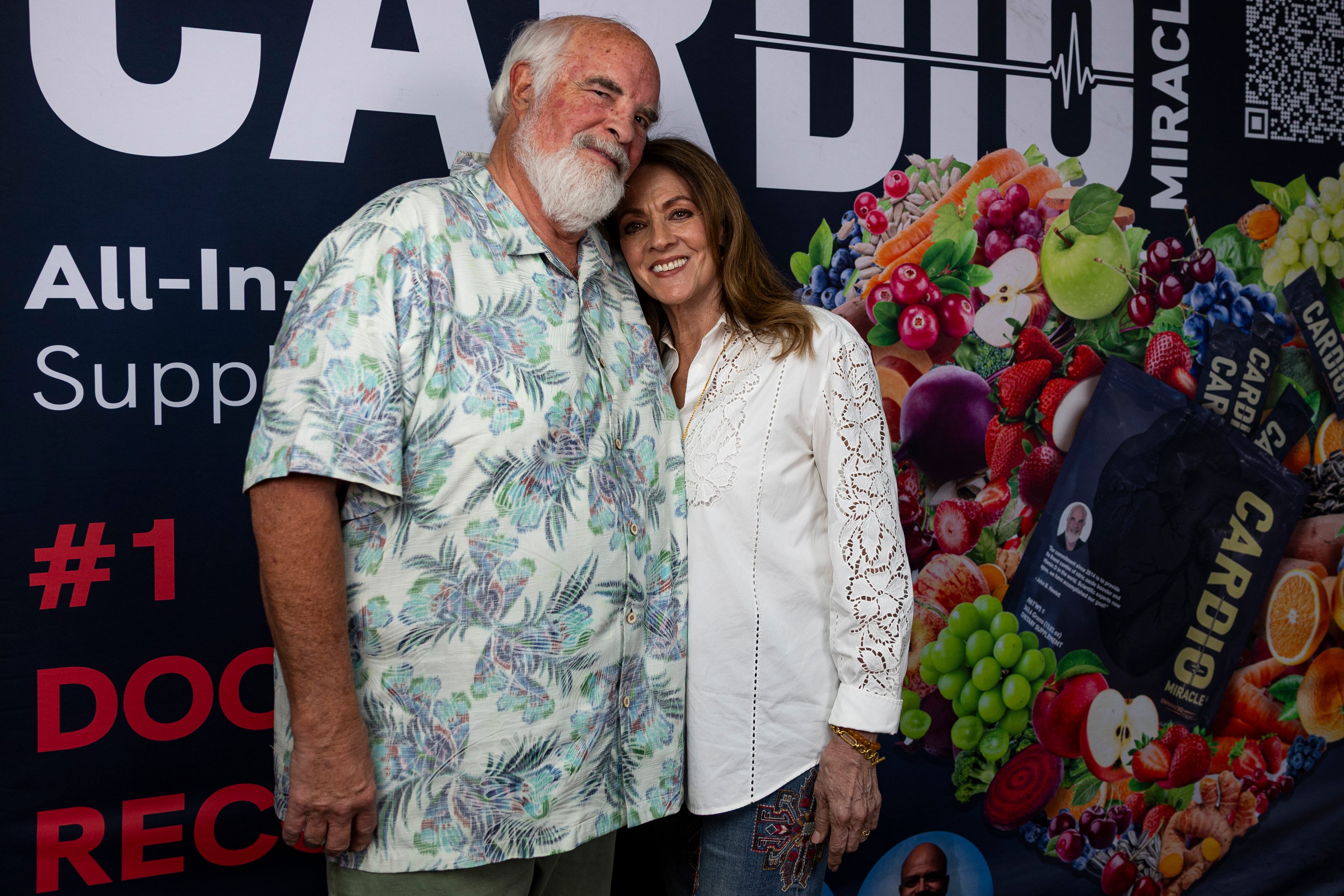 Cardio Miracle founder John Hewlett, left, and his wife, Janet, right, pose for a photo at the Cardio Miracle warehouse in West Jordan on July 2.