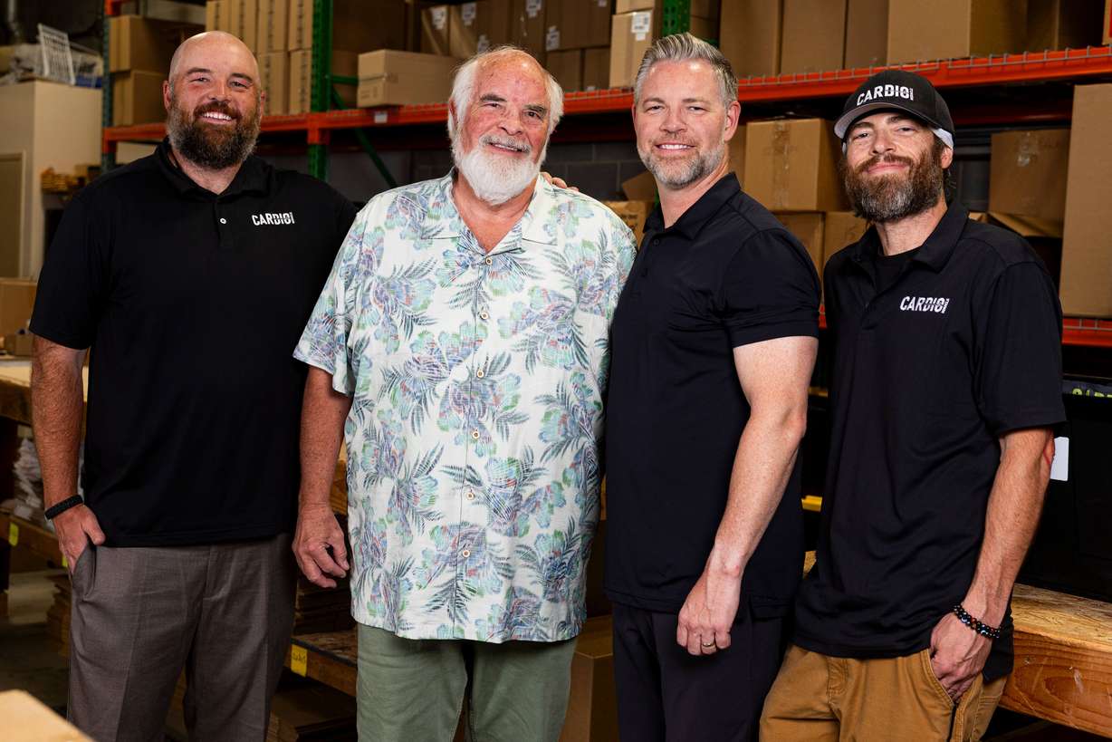 Cardio Miracle founder John Hewlett, center left, poses for a photo with his sons Joshua, left, Jason, center right, and Jared, right, at the Cardio Miracle warehouse in West Jordan on July 2.