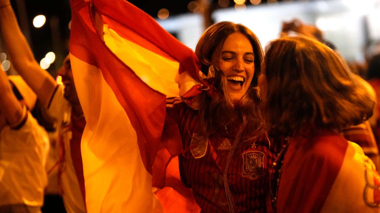 Spanish fans celebrate in central Madrid after Spain defeated Argentina in the World Cup final soccer match in East Rutherford, N.J., near New York, Sunday, July 19, 2026.