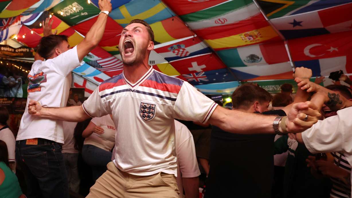 England soccer fans celebrate during the World Cup semifinal soccer match between England and Argentina at The Clock pub in Hebburn, England, Wednesday, July 15, 2026.