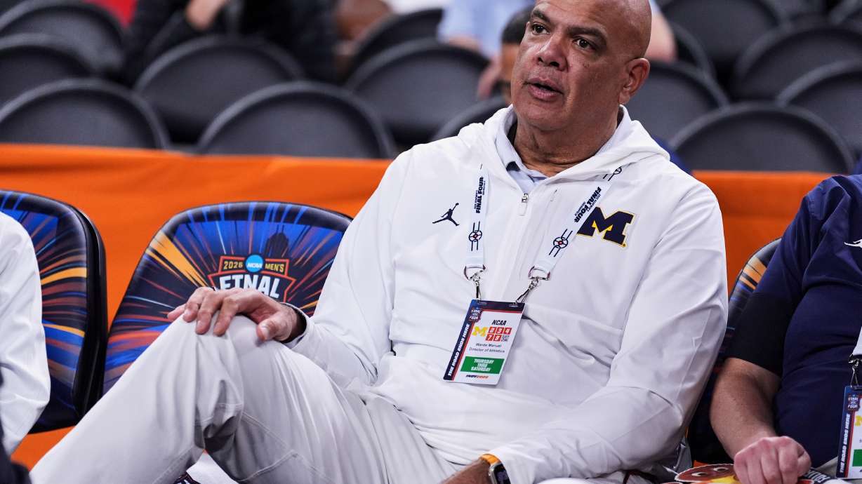 FILE - Michigan athletic director Warde Manuel watches Michigan practice ahead of an NCAA college basketball tournament semifinal game against Arizona at the Final Four, April 3, 2026, in Indianapolis.